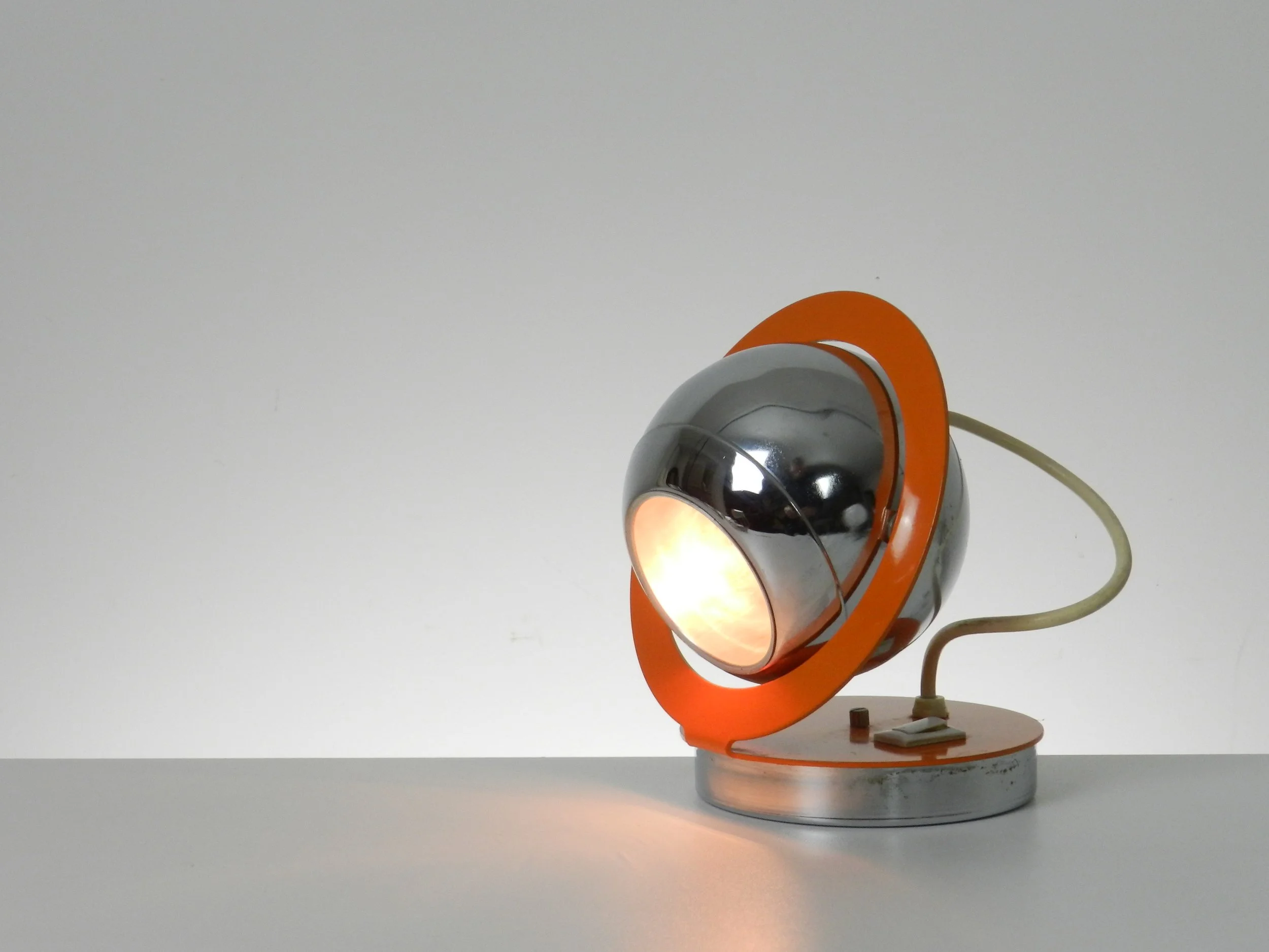 Space age eyeball lamp in enemeled metal and chrome.  Italy, 1970s.
