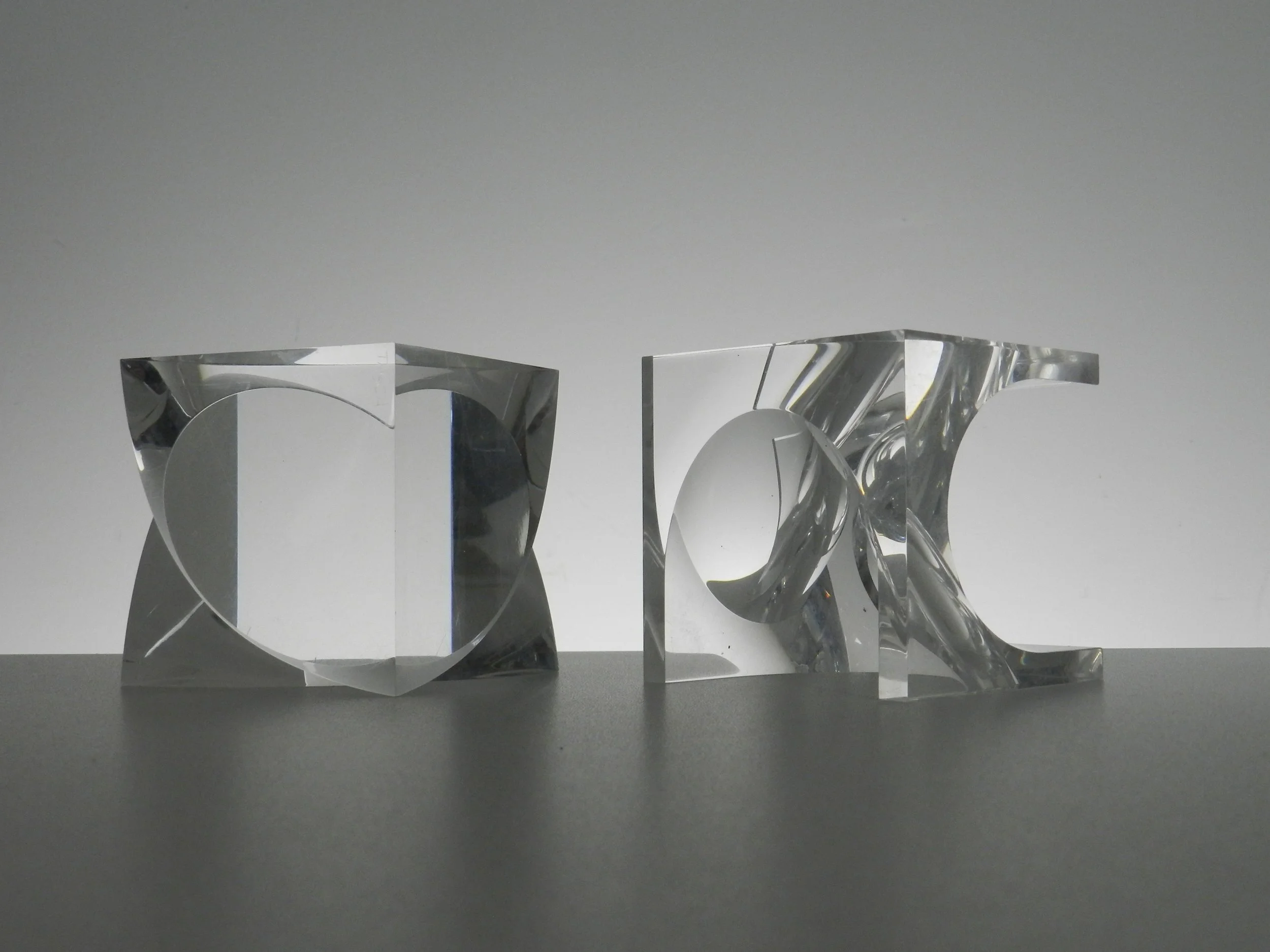 Pair of prismatic lucite sculptures by Alessio Tasca.  Italy, 1970s.