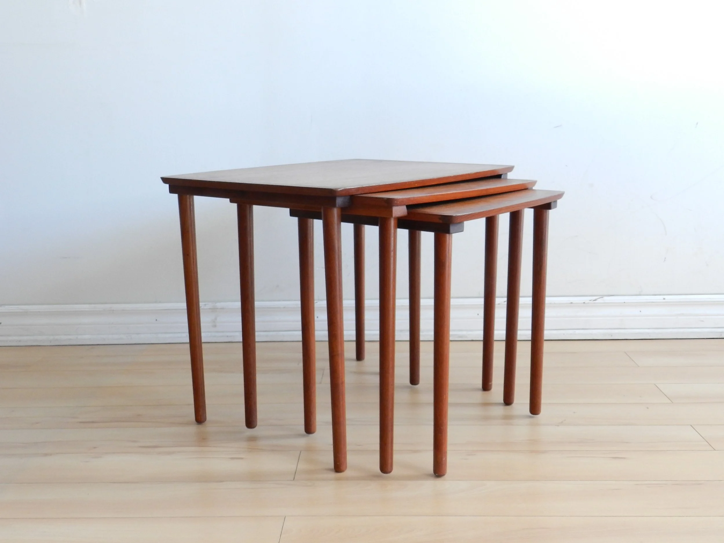 Set of three teak nesting tables by Mobelintarsia.  Denmark, 1960s.