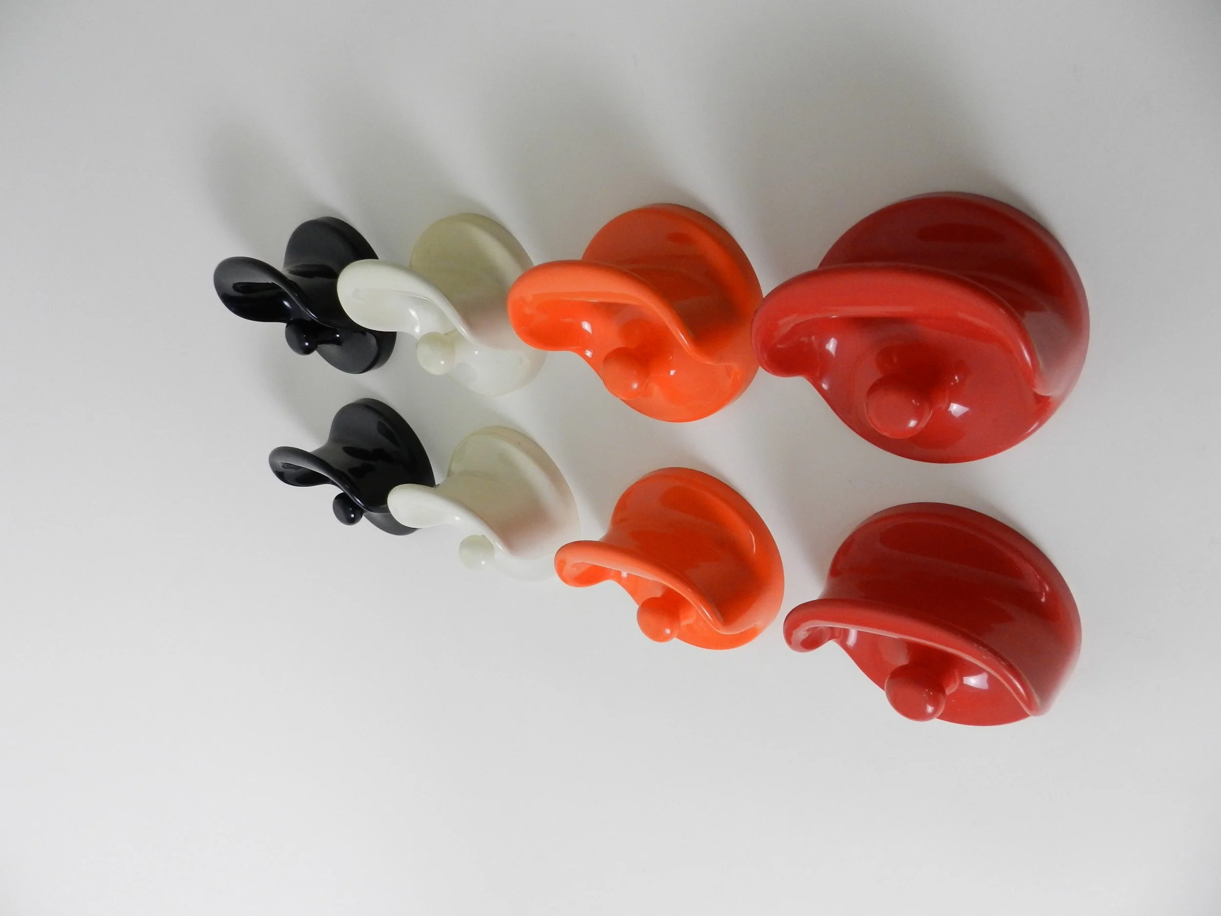 Vintage set of plastic wall mounted coat hooks designed by Olaf Von Bohr for Kartell.  Italy, 1970s.
