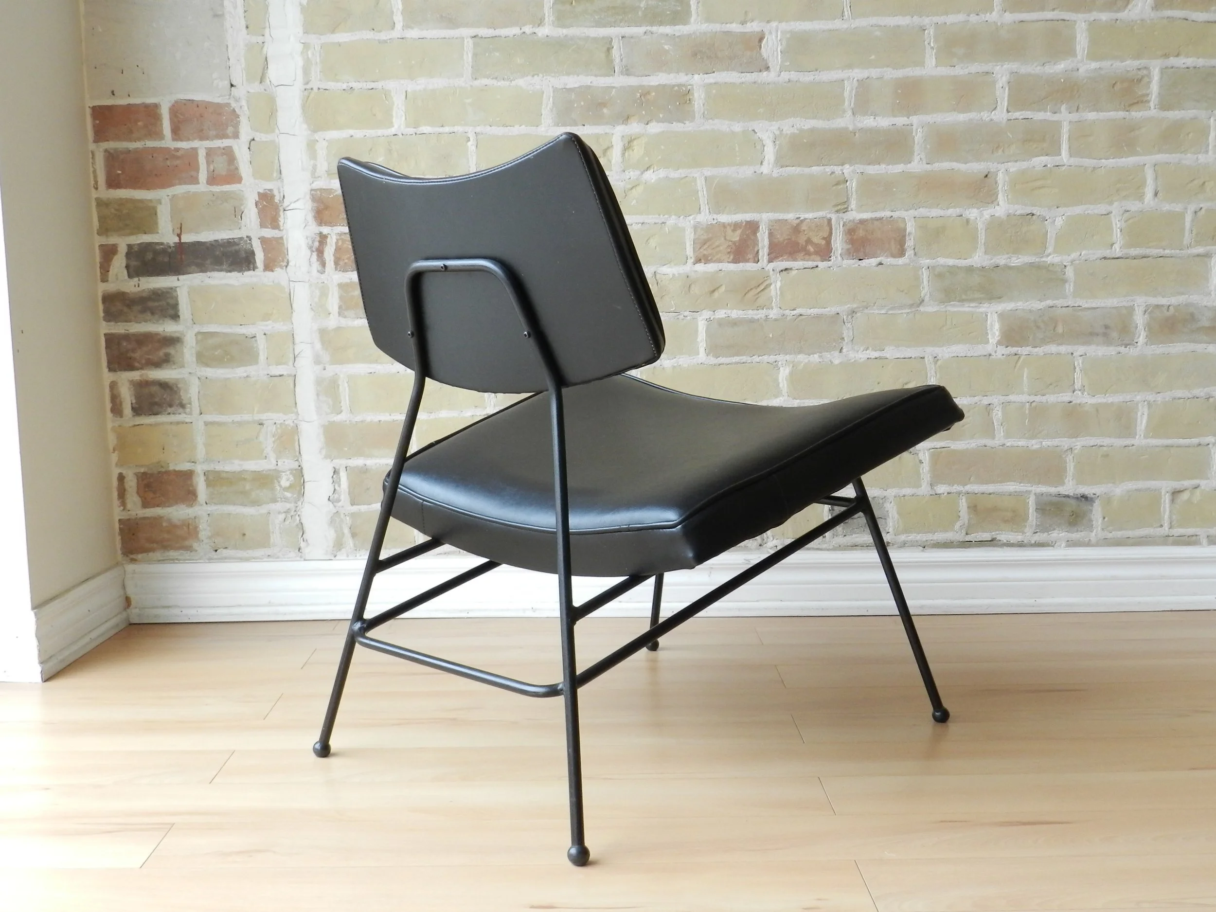Pair of rare Canadian design Video Chairs by Arrow Bedding. Wrought iron and bent plywood with vinyl upholstery.  Canada, 1950s.