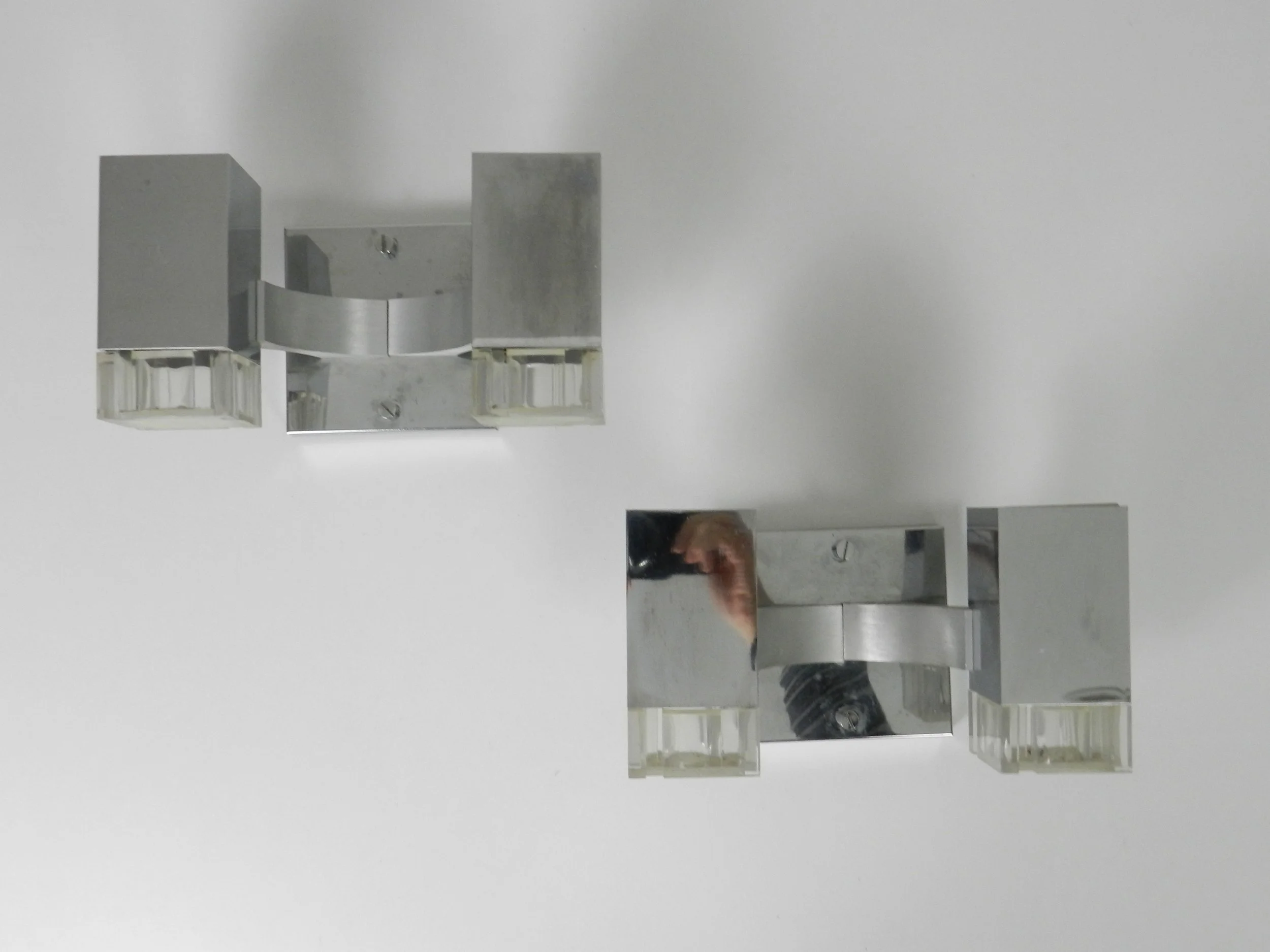 Pair of chrome and acrylic Cubic wall sconces designed by Gaetano Sciolari for Sciolari.  Italy, 1970s.