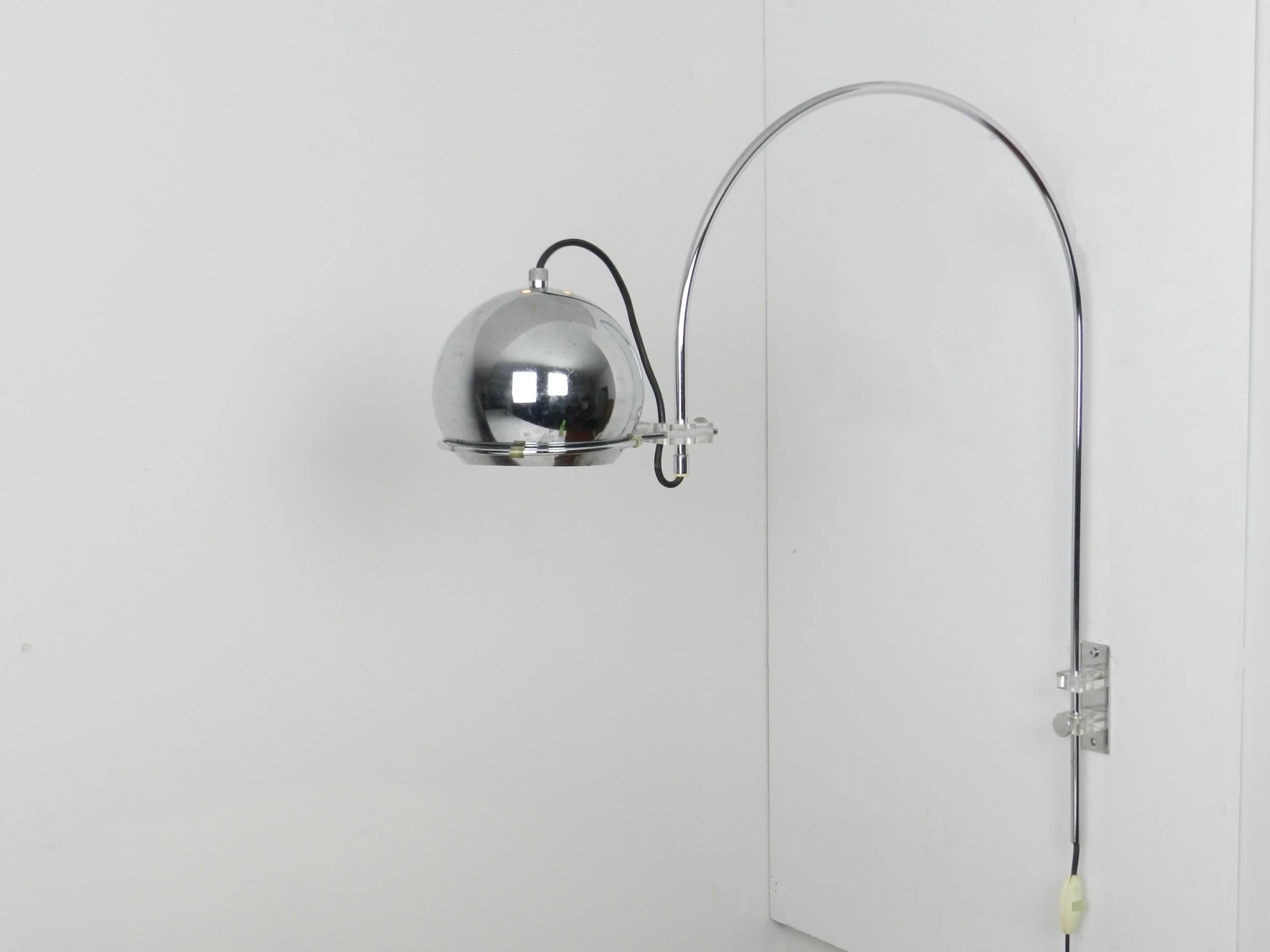 Chrome space age arc wall lamp by Gepo.  Netherlands, 1970s.