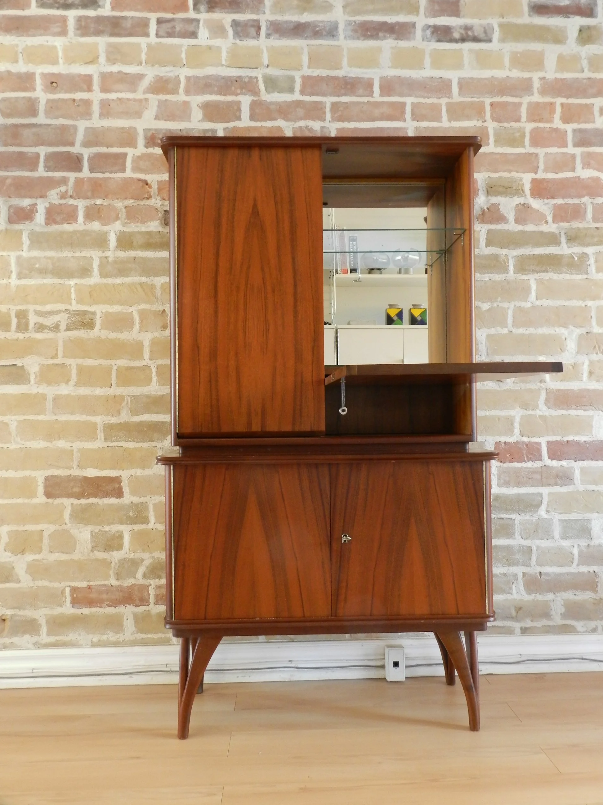 Compact rosewood bar cabinet with drop down door.  Scandianvia, 1960s.