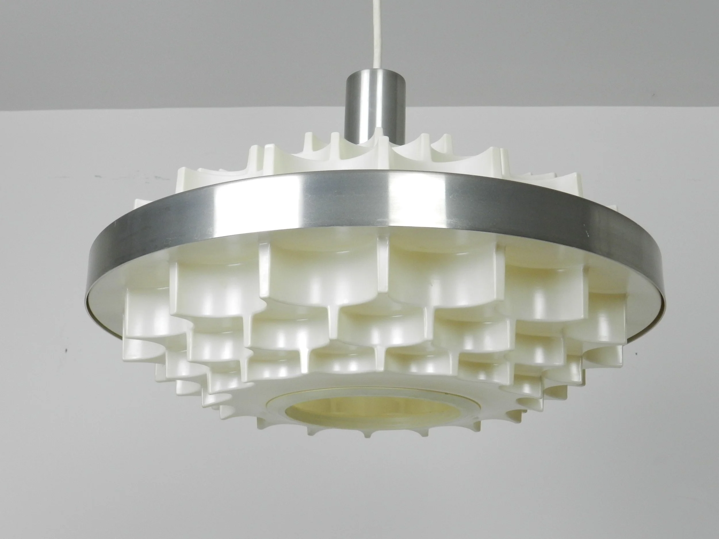 Mid century pendant lamp in plastic and aluminum. Attributed to Lars Schioler for Hoyrup.  Denmark, 1960s.