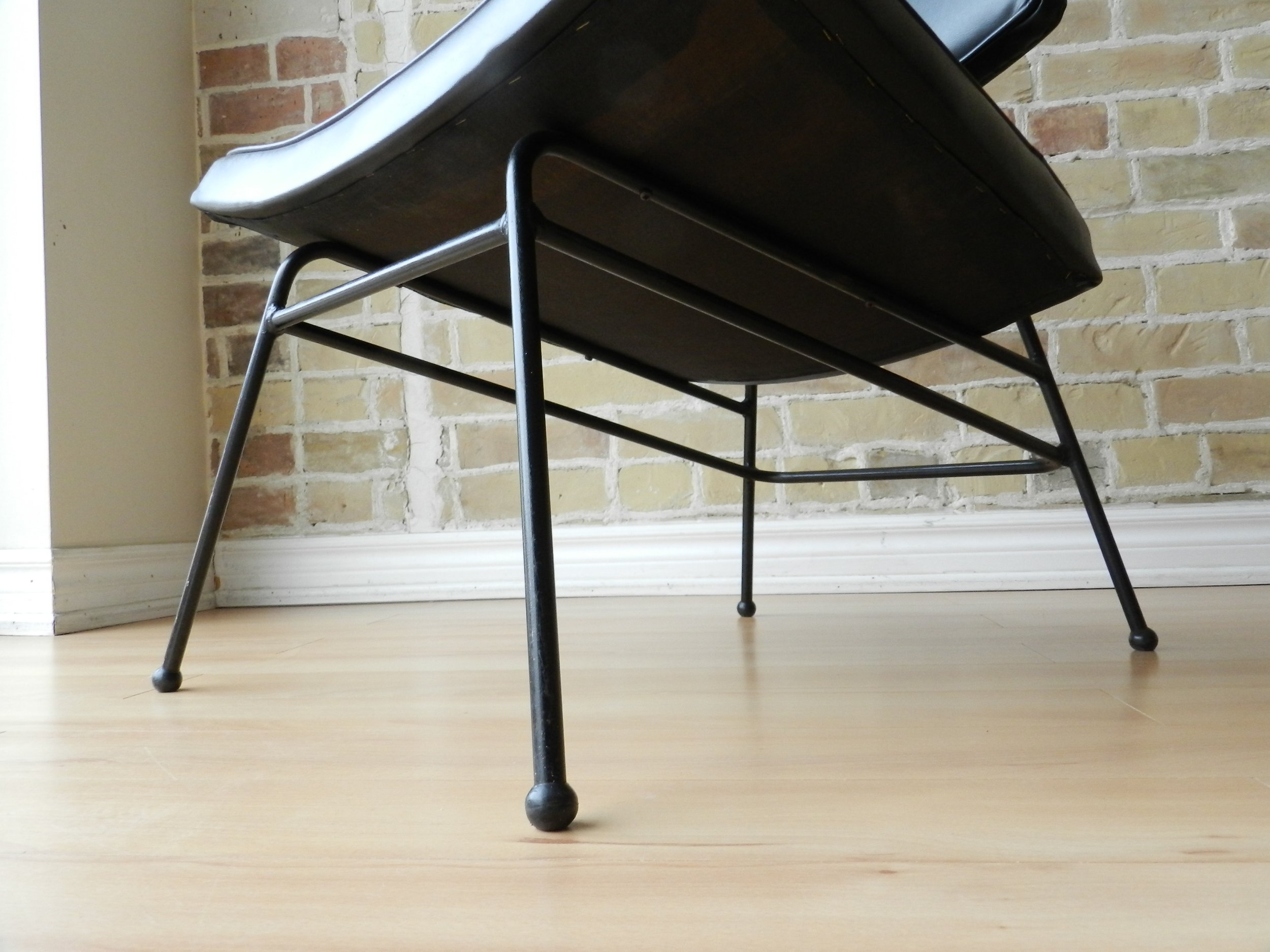 Pair of rare Canadian design Video Chairs by Arrow Bedding. Wrought iron and bent plywood with vinyl upholstery.  Canada, 1950s.