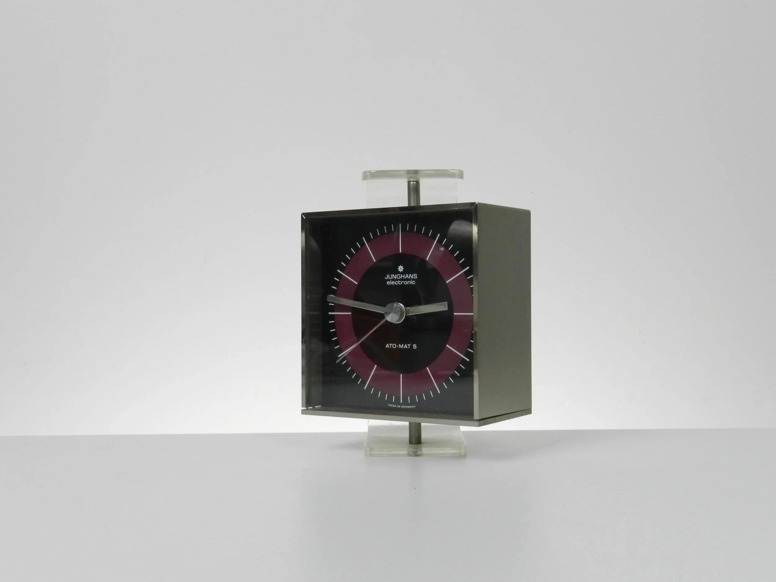 Modernist clock in steel and lucite by Junghans. Table top or wall mounted.  Germany, 1970s.