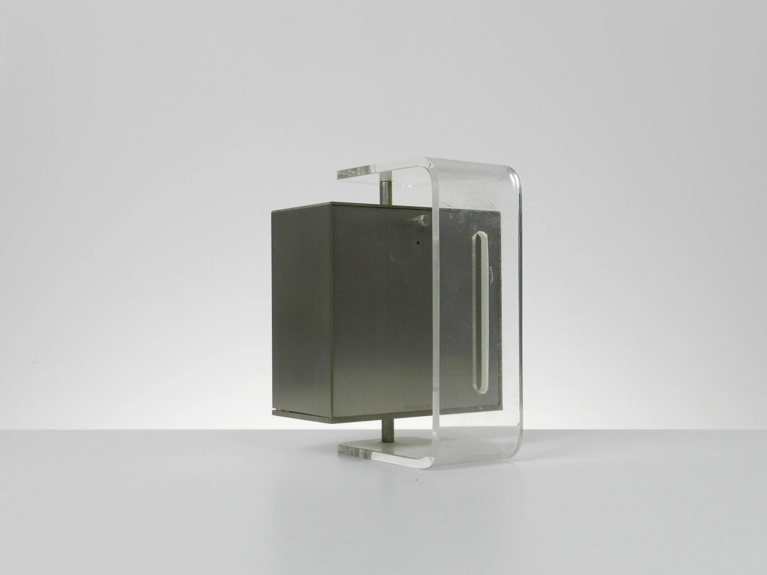 Modernist clock in steel and lucite by Junghans. Table top or wall mounted.  Germany, 1970s.