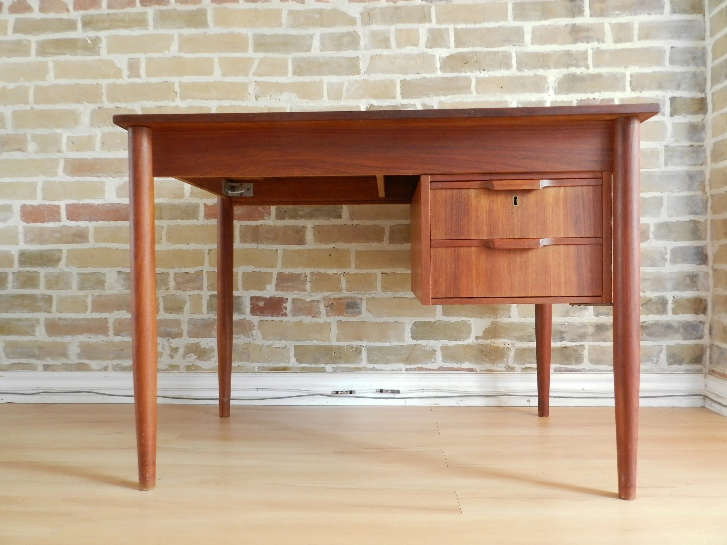 Compact teak desk with two drawers.  Denmark, 1960s.