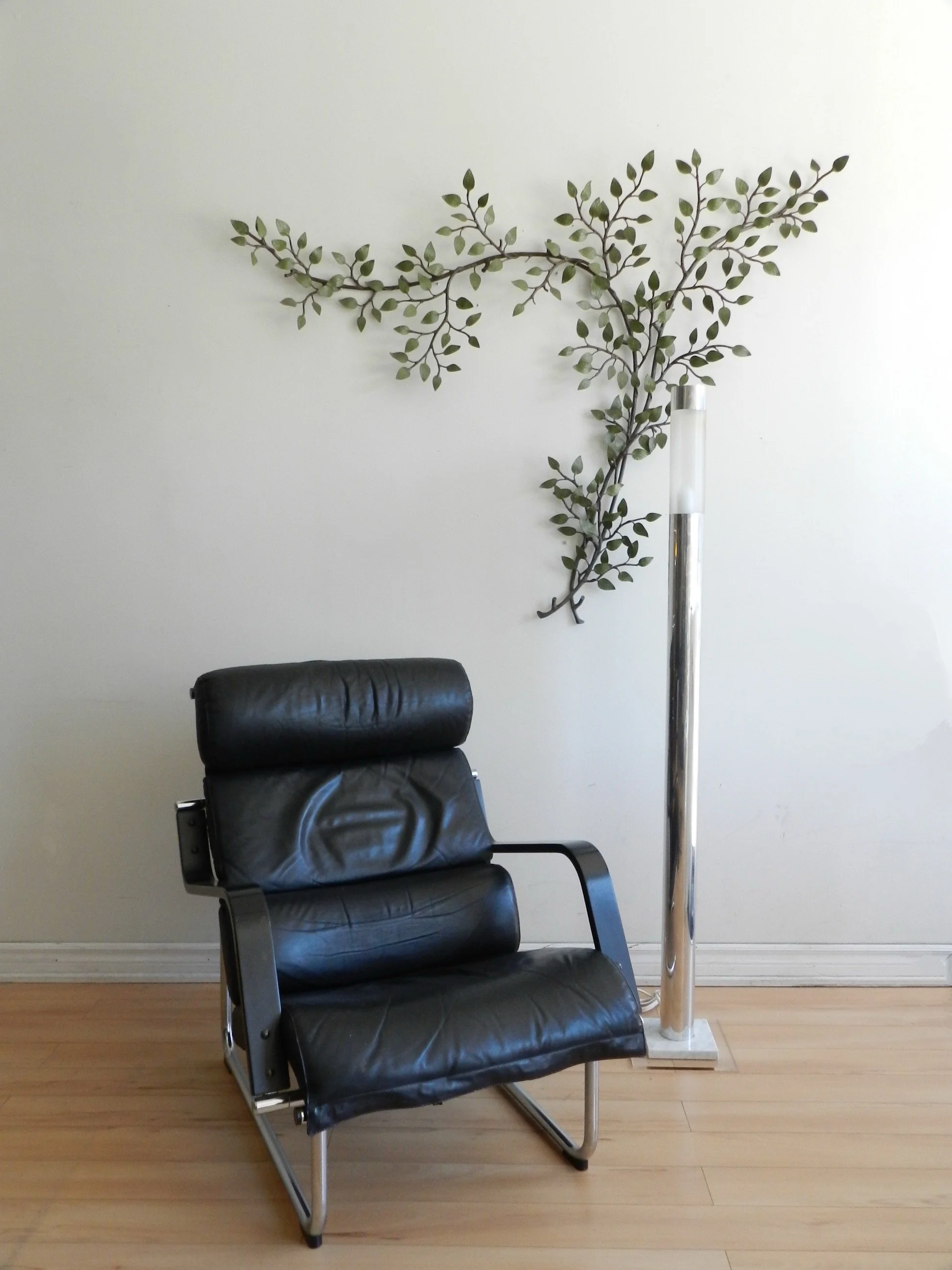 Vintage high quality wall sculpture of branch with leaves in painted metal.  circa 1940s.
