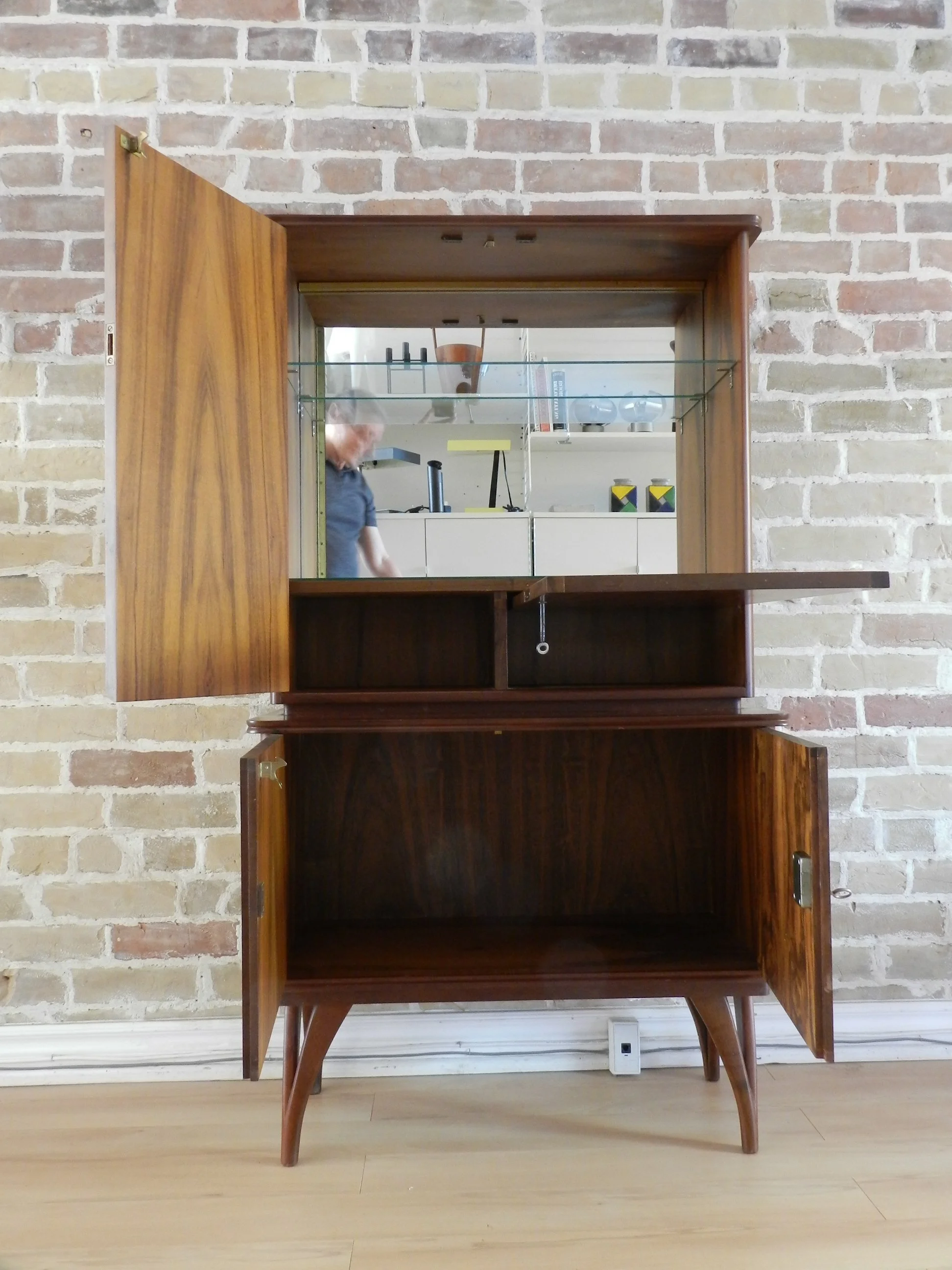 Compact rosewood bar cabinet with drop down door.  Scandianvia, 1960s.