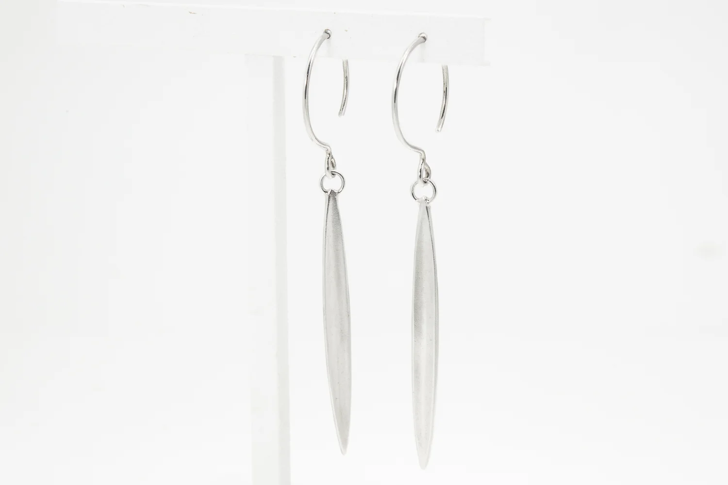 Long concave silver seeds on rounded ear wires
