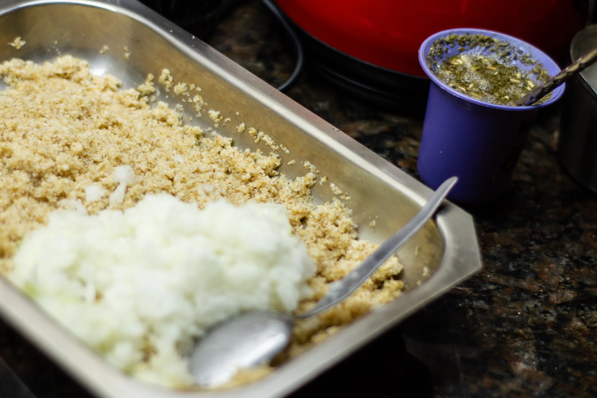 Soaked and drained bulgur with grated onion, mate alongside.