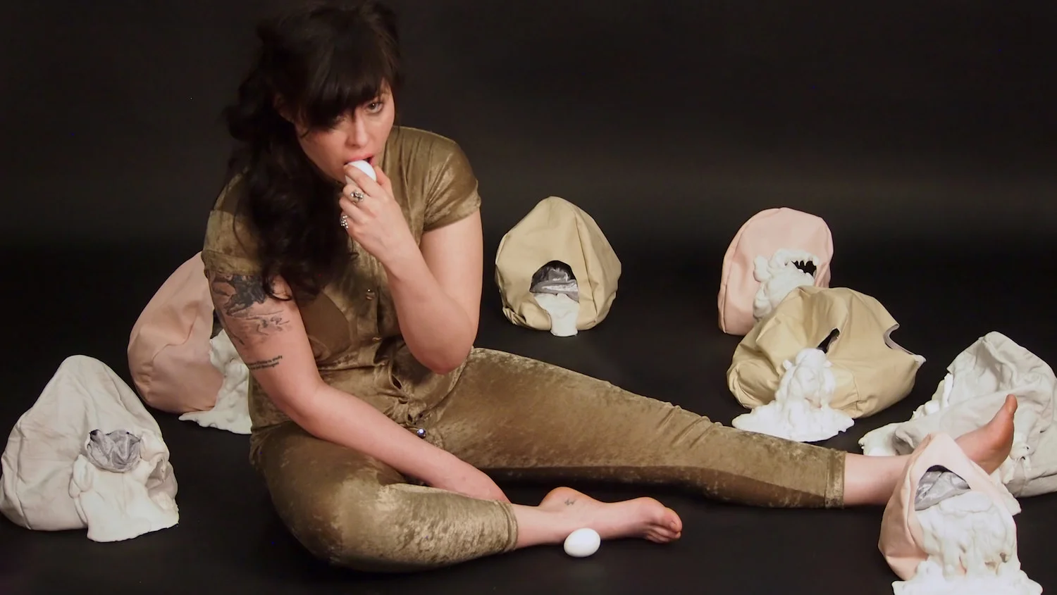 Yolk, Yokes, and Ovaries (objects and costume) Leather, plaster, stretch velvet, industrial snaps watch the film