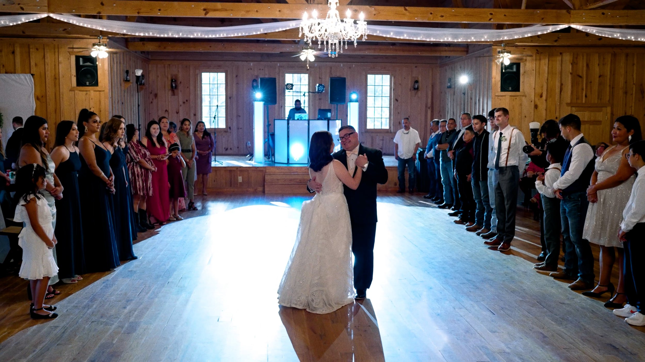 bride dances with father of bride at reception wide