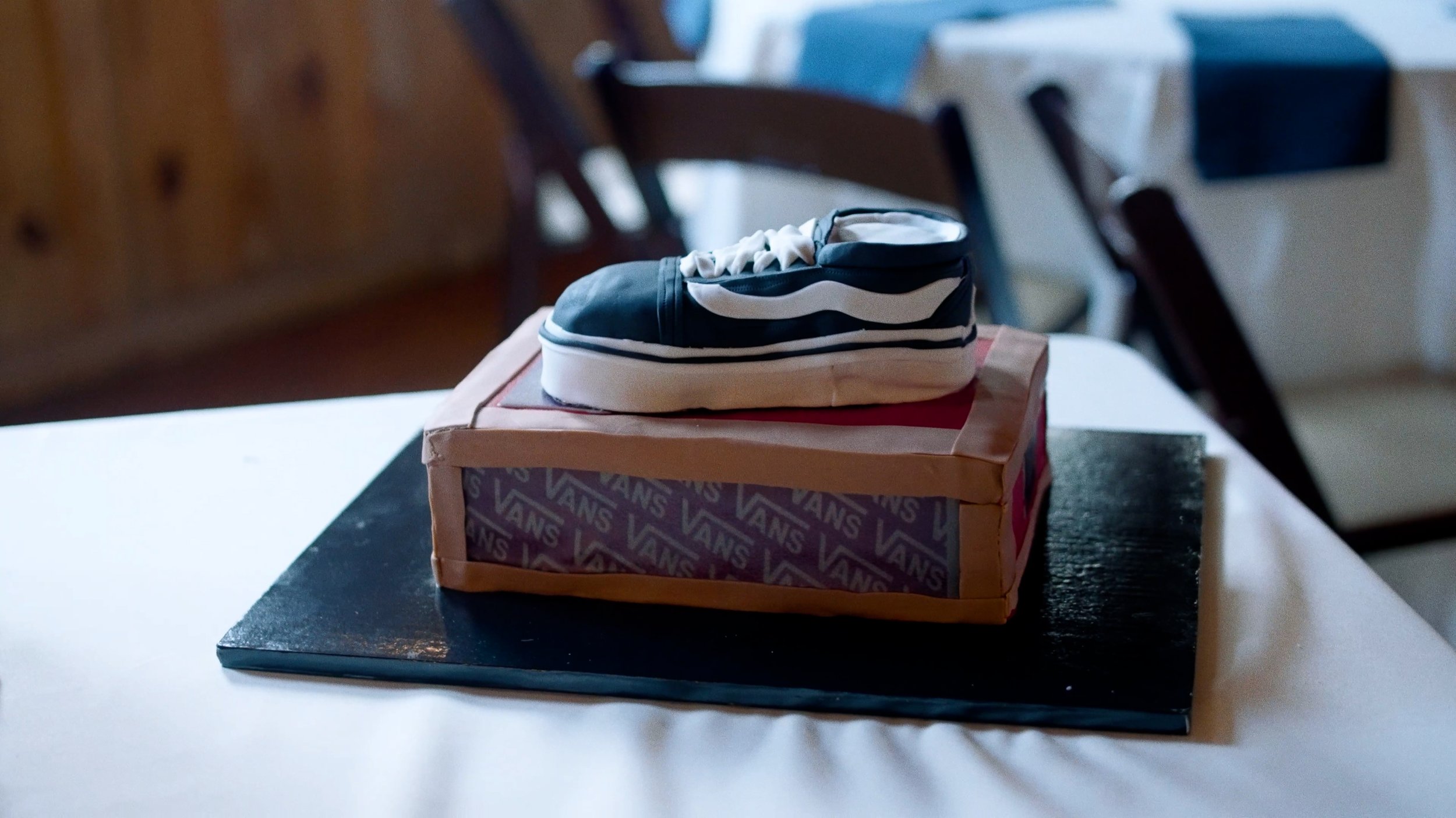 groom cake with vans shoes on top