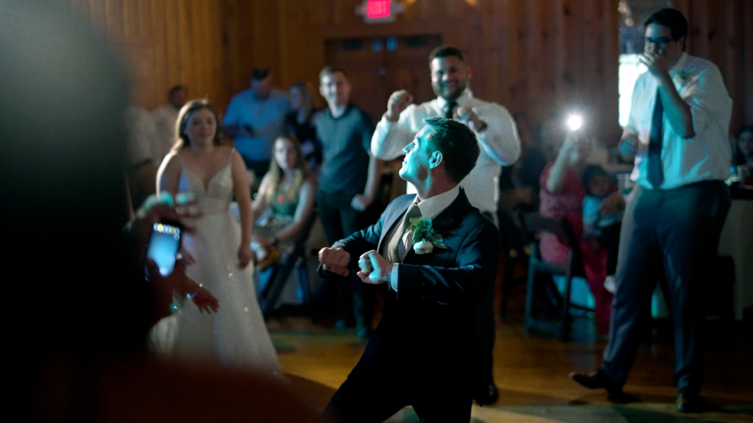 groom dancing on dance floor at wedding reception