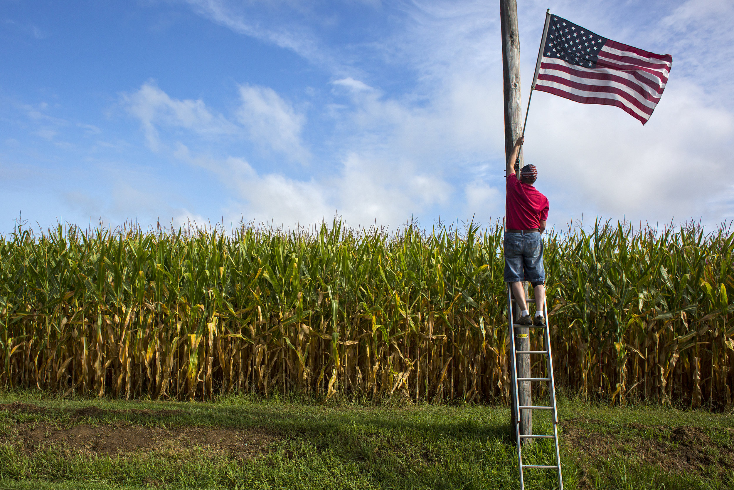 For 30 years, Bob Meyer has placed American flags along roadways in his hometown of St. Henry. "What started out as just decorations went much, much deeper. It's the symbol of freedom," Meyer said Sept. 2 after completing a round of flag placement. "And that ties in big time with all these veterans here in this town." He said his mother, Nip Meyer, was on the decorating committee when the community celebrated its 125th anniversary in 1987 and asked him to put up the flags initially. Three decades later, Meyer is still placing the flags out for Labor Day, Memorial Day, Fourth of July, Veterans Day, September 11 and the community's annual festival. "When I started I thought, 'Well I'll do them as long as my mom wants me to," he said. "And then bless her heart, she's still here today for this 30th anniversary." — Sept. 2, 2017, St. Henry, Indiana.
