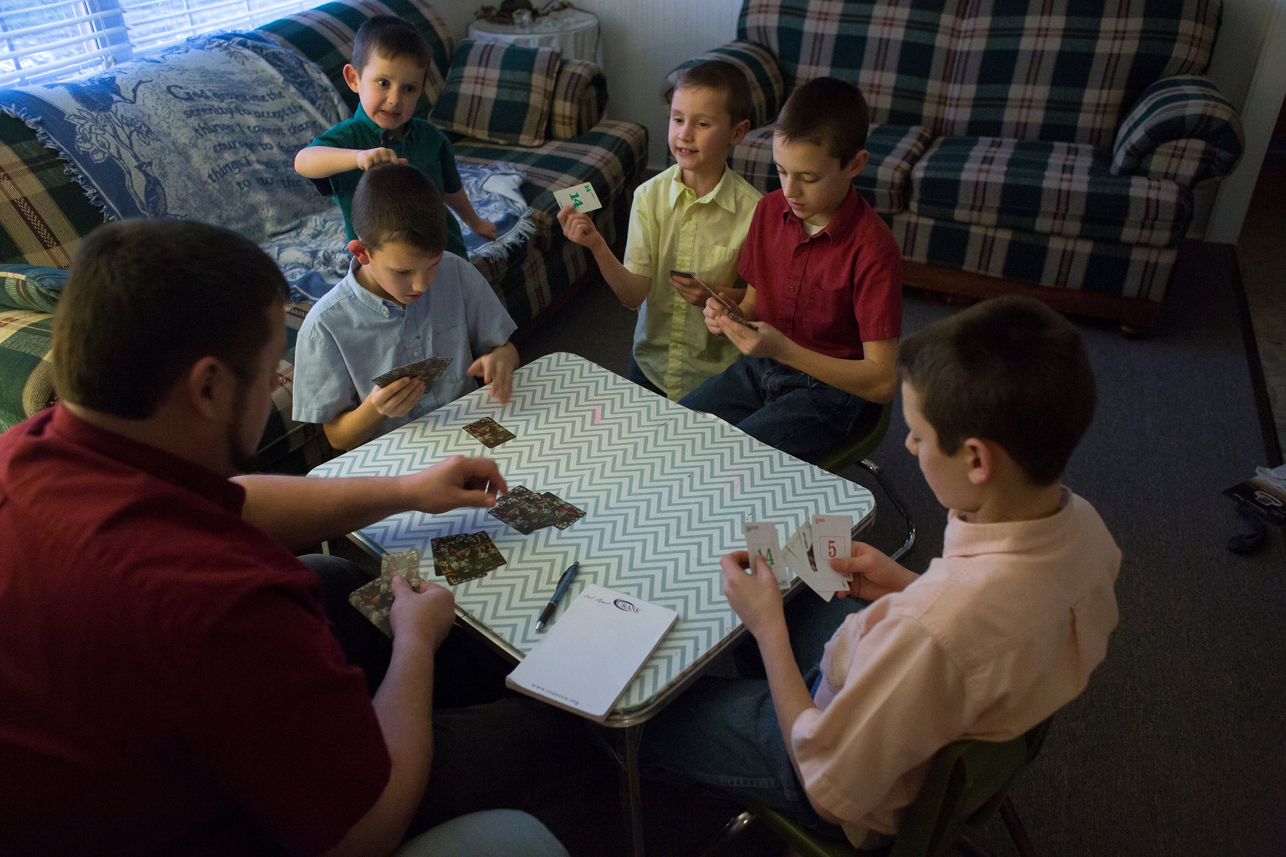 Stanley played Rook with his sons — Bryant, Cody, Darius, Tyler and Zachary — to pass time before dinner Dec. 30. Because they don’t have a television, reading books and playing games like Rook are common occurrences in the Knepp household. During the warmer months of the year, the children spend more time with outdoor activities. 