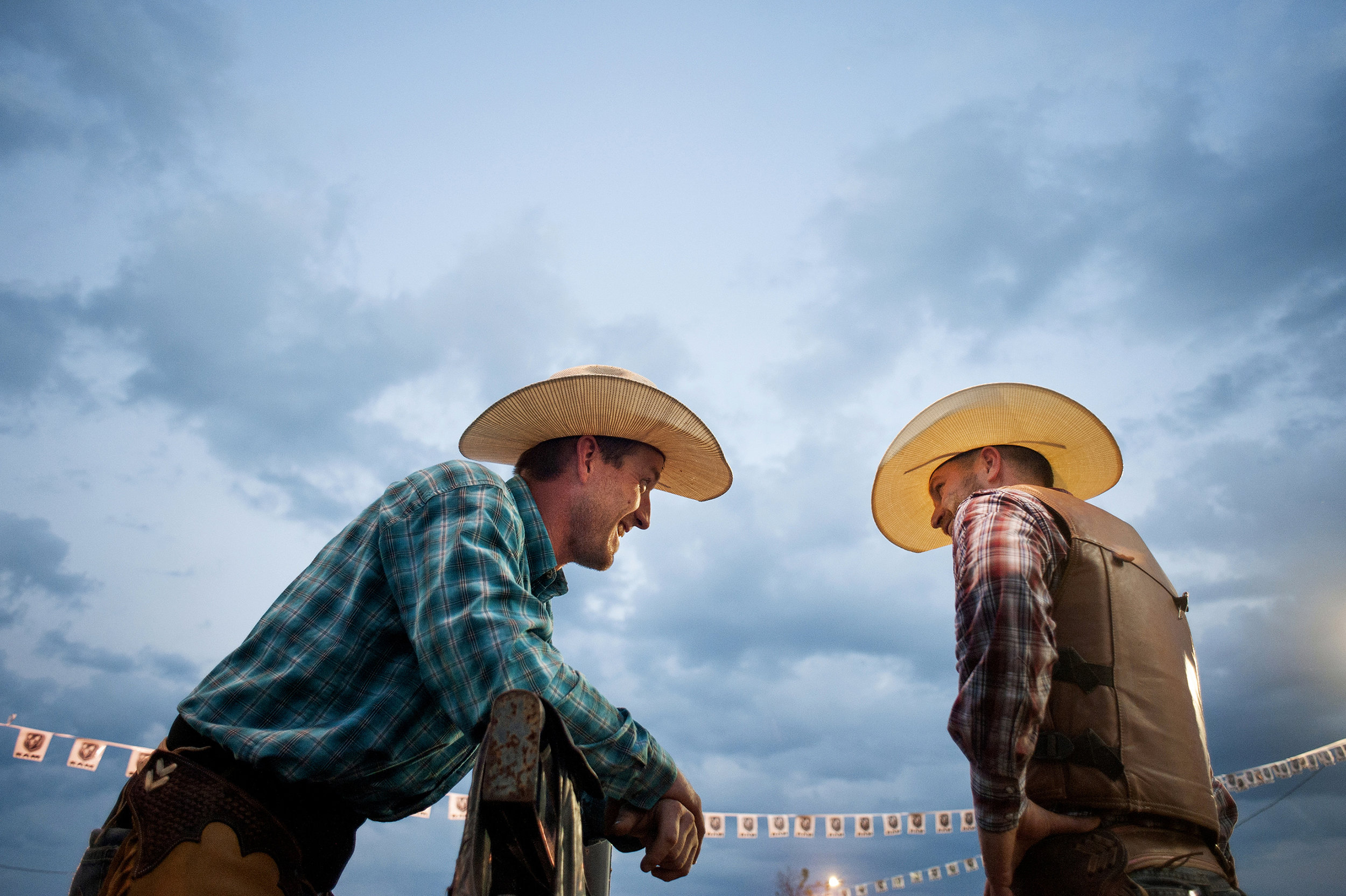  Kirk Nelson, of Branson, Mo., and Keith Brauer, of Belleville, Ill., speak before the start of their competitions. “For me, it’s just keeping the American West alive and letting people know that cowboys are still out there,” Brauer said. “It’s a way