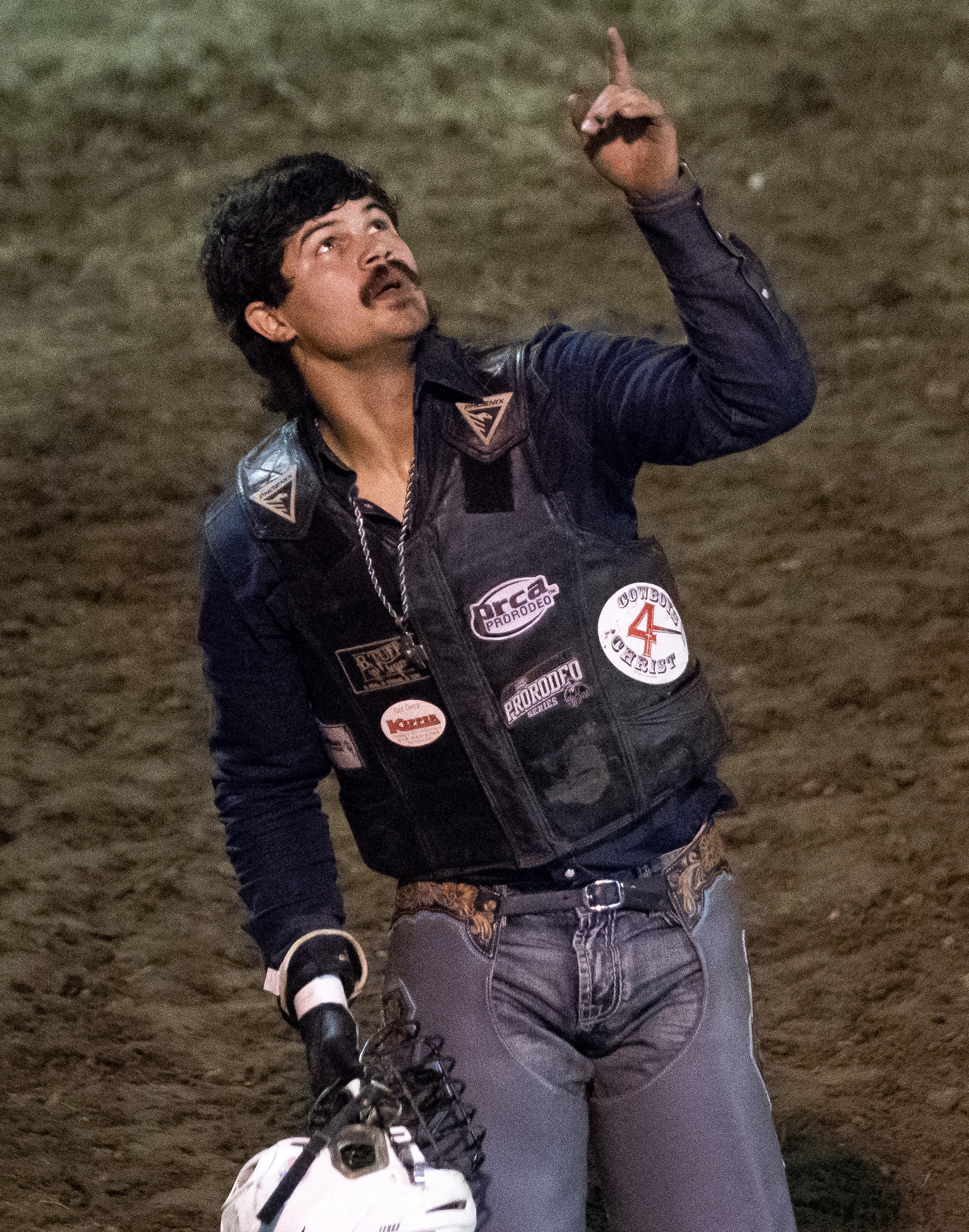Mincey points toward the sky while celebrating successfully riding his bull for a full eight-second ride. Mincey, who turned 24 the day following rodeo, won the bull riding portion of the event. “Cowboys is a dying breed,” Mincey said while speaking about rodeo. “So each day that we get to do it is a blessing.”
