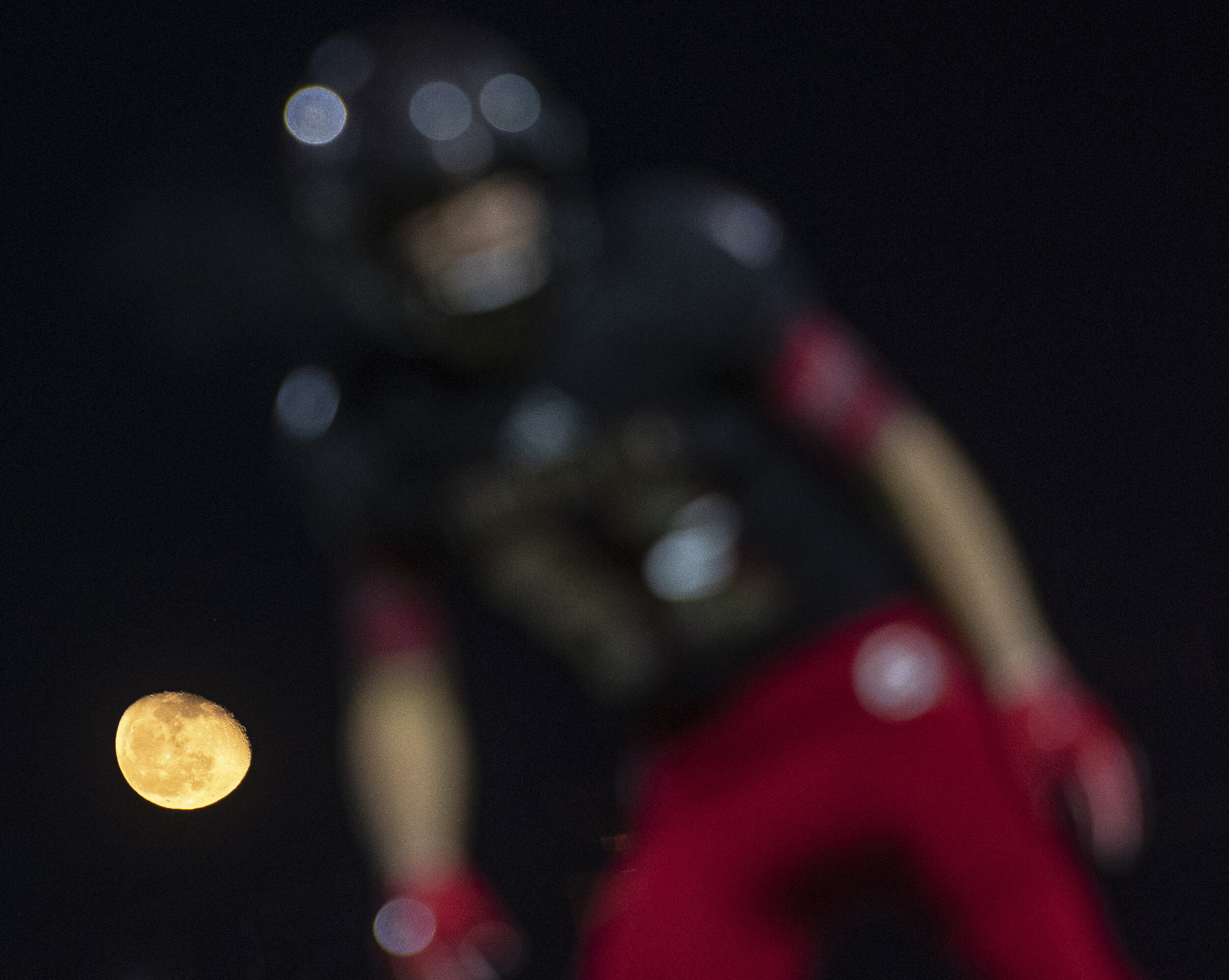  The moon is pictured with a Jackson Indian during the Jackson Indians' matchup against the Fox Warriors in the Class 5 District 1 championship Friday, Nov. 15, 2019, in Jackson.  