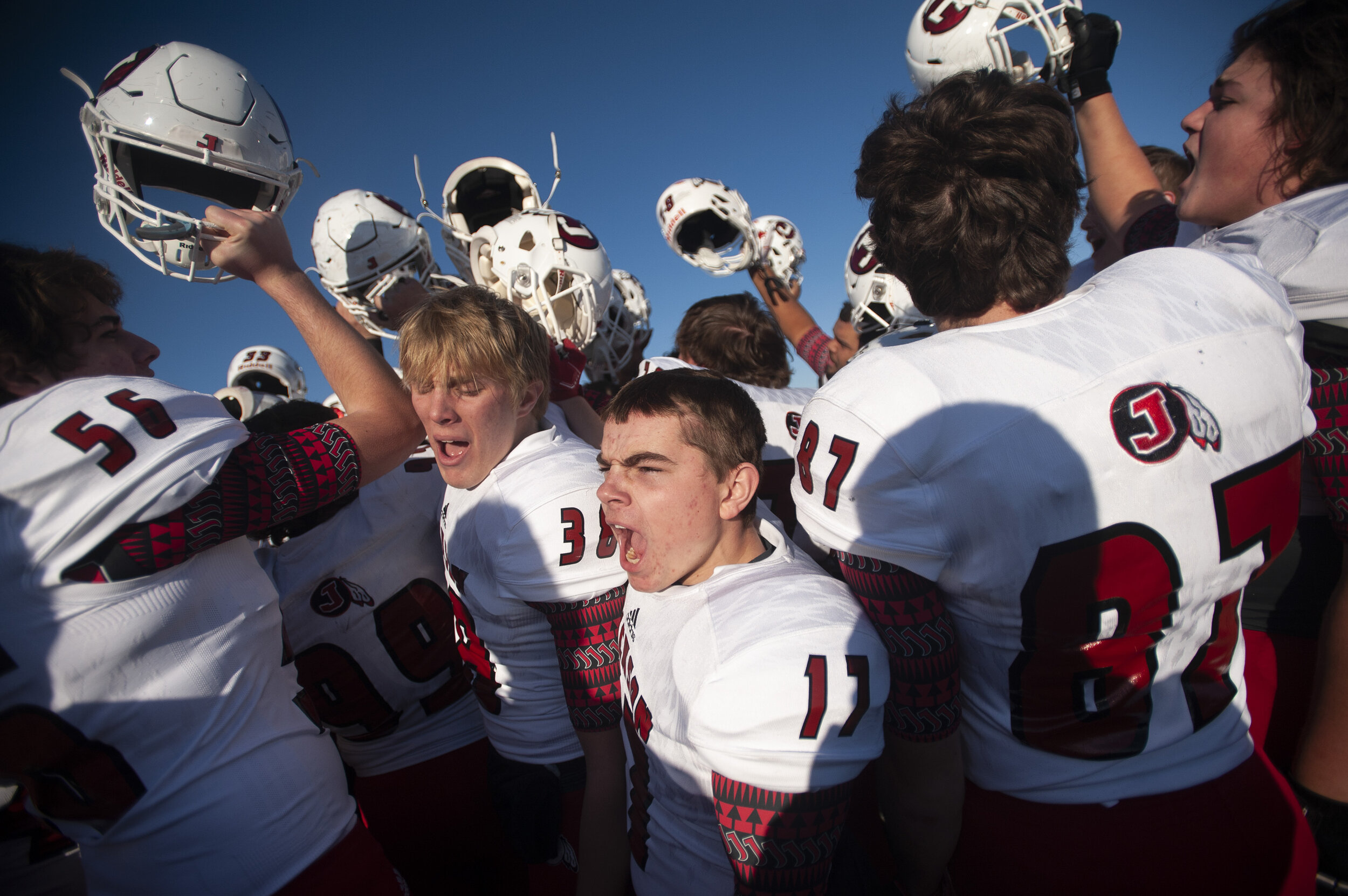  Jackson's Matthew Stroder (17) and Adam McClanahan (38) gather with teammates following Indians' 20-7 victory over Staley High School in the MSHSAA Class 5 state semifinals Saturday, Nov. 30, 2019, in Kansas City, Missouri. 
