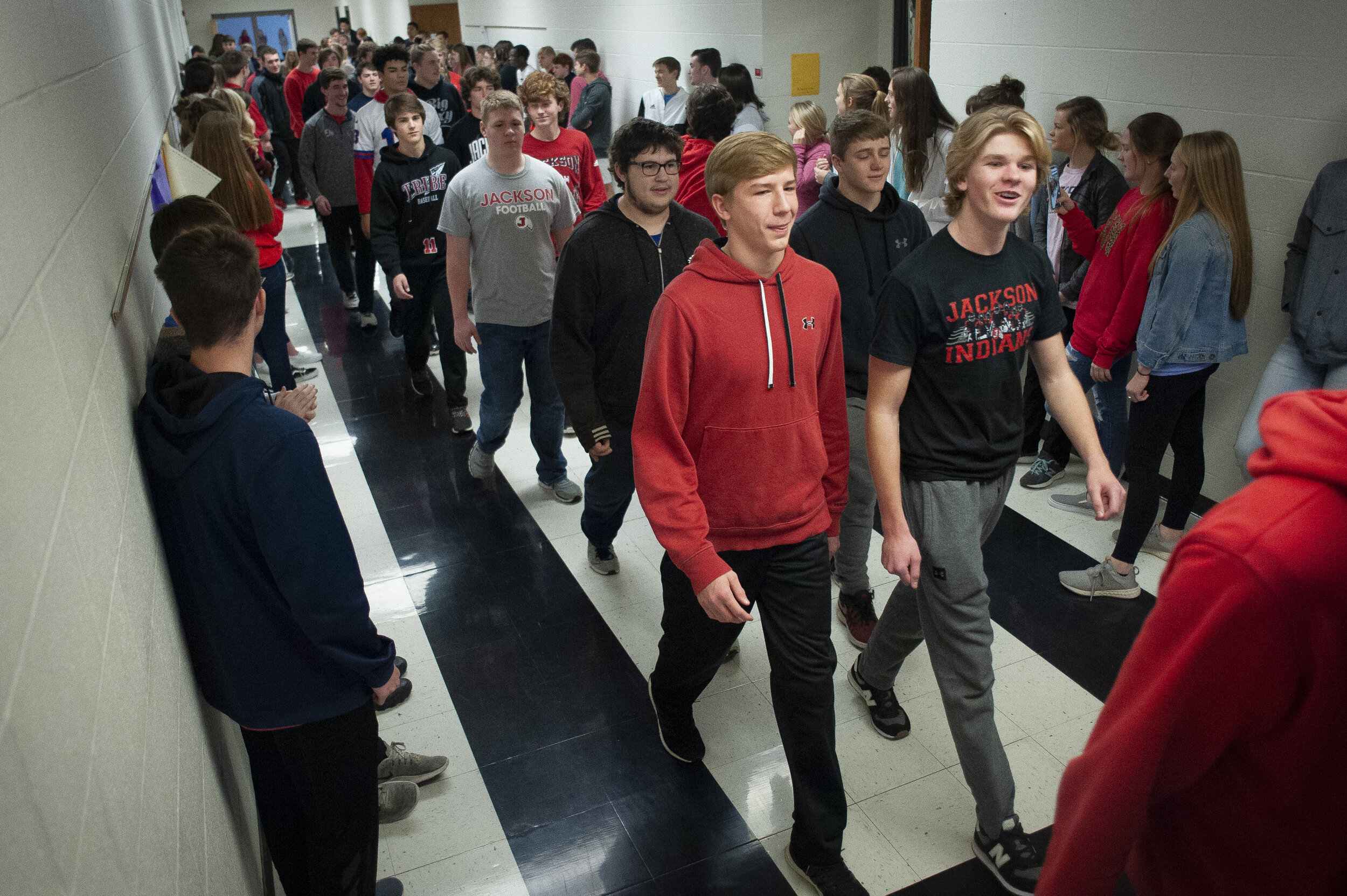  Jackson football players take part in a procession through Jackson High School shortly before departing for the Class 5 state championship Friday, Dec. 6, 2019, in Jackson.  