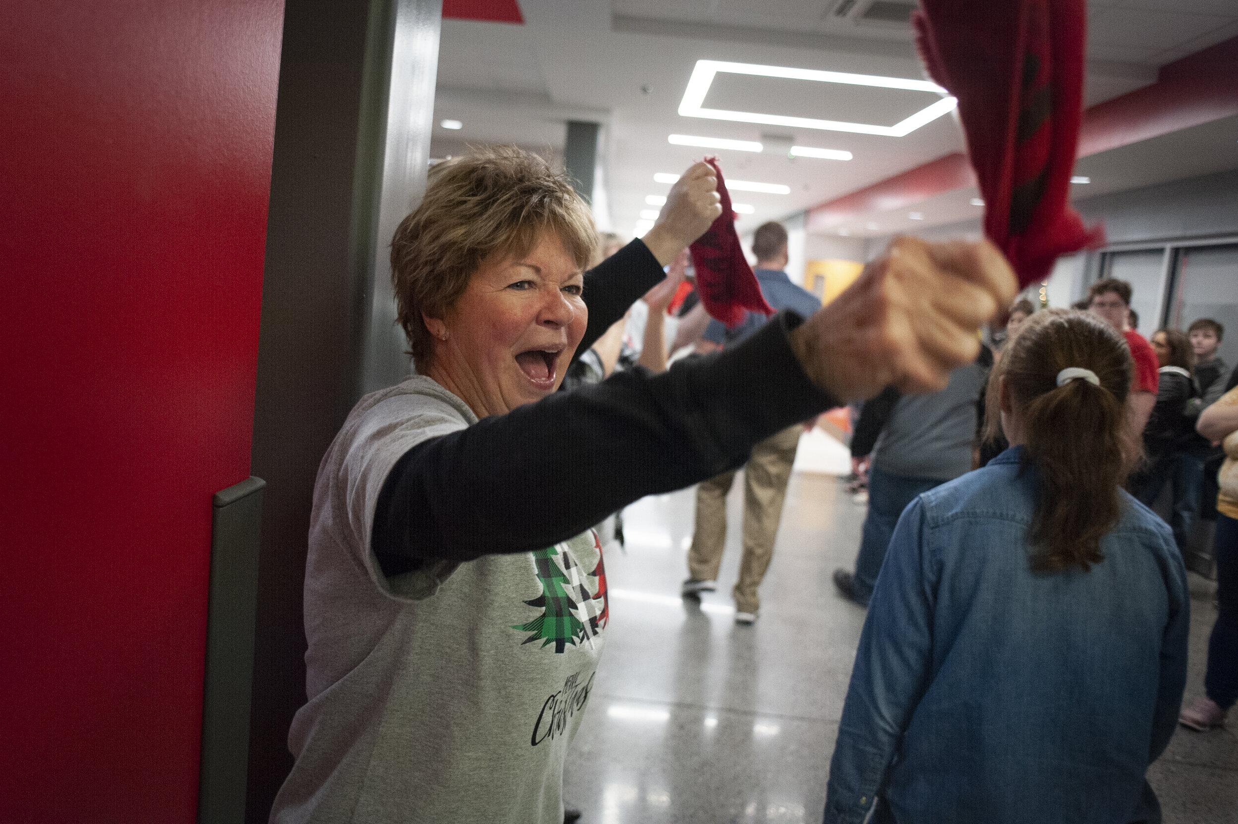  Sharon Sink cheers as Jackson football players take part in a procession through Jackson High School shortly before departing for the Class 5 state championship Friday, Dec. 6, 2019, in Jackson.  