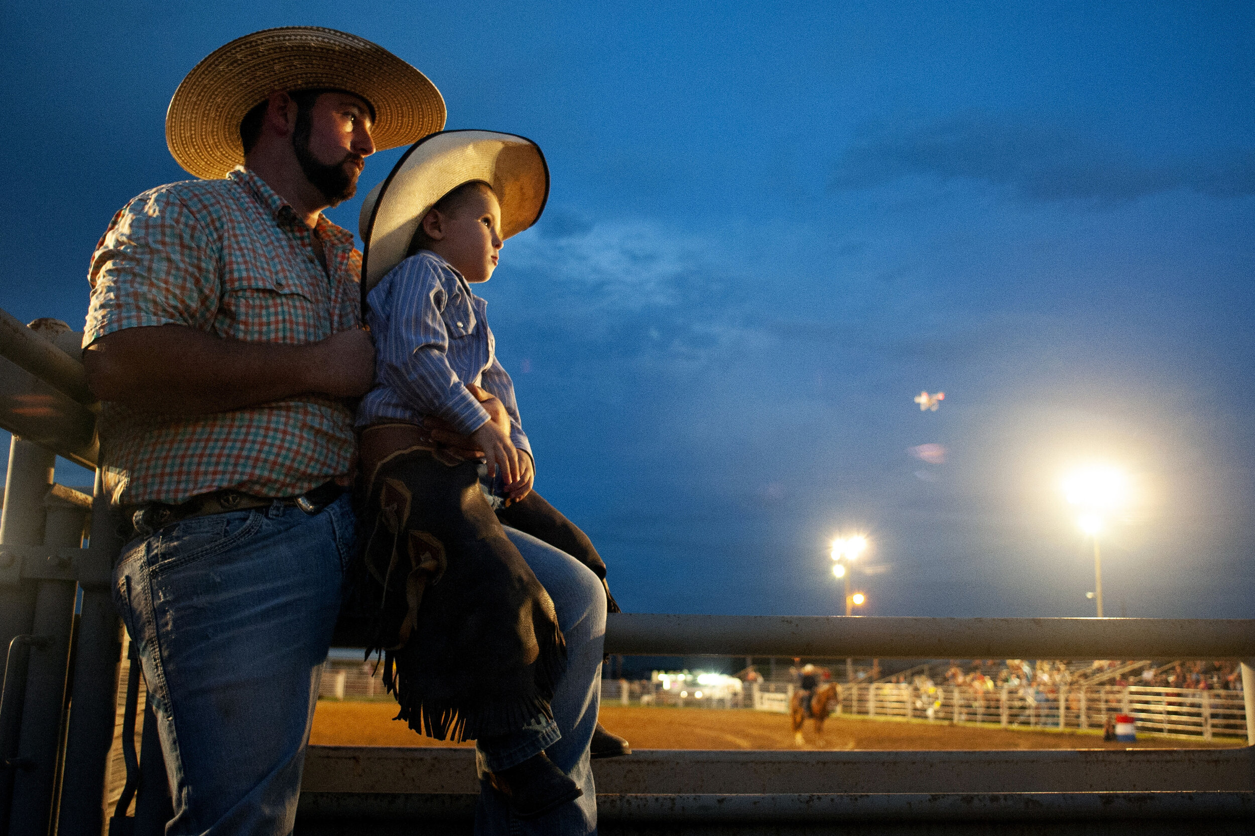  Chase McClelland, of Cardwell, Missouri, and his cousin Elliot Smith, 4, of Arbyrd, Missouri, sit atop a chute during the bull riding portion of the Greene County Fair's rodeo Sept. 6 in Paragould, Arkansas. McClelland said his cousin came to the ro