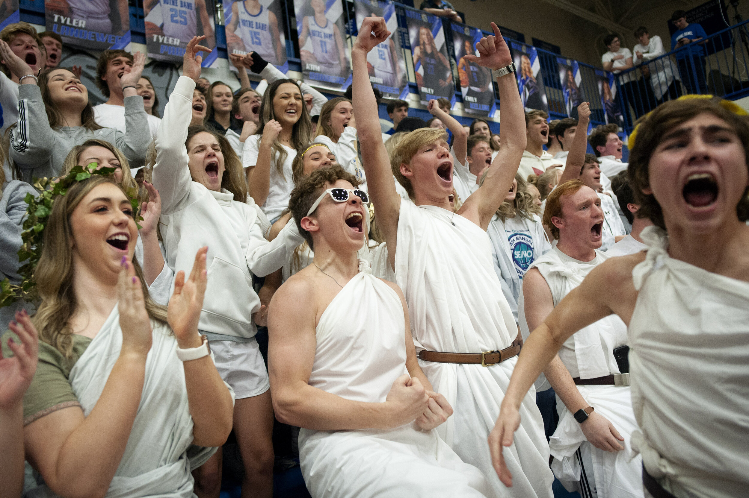  Notre Dame seniors (front row from left) Madeline Hulshof, Tanner Peters, Blake Morris, Brent Vandeven and Cristian Evans (right in foreground) cheer while attending the Notre Dame Bulldogs' 67-52 win over the Jackson Indians on Jan. 31 at Notre Dam