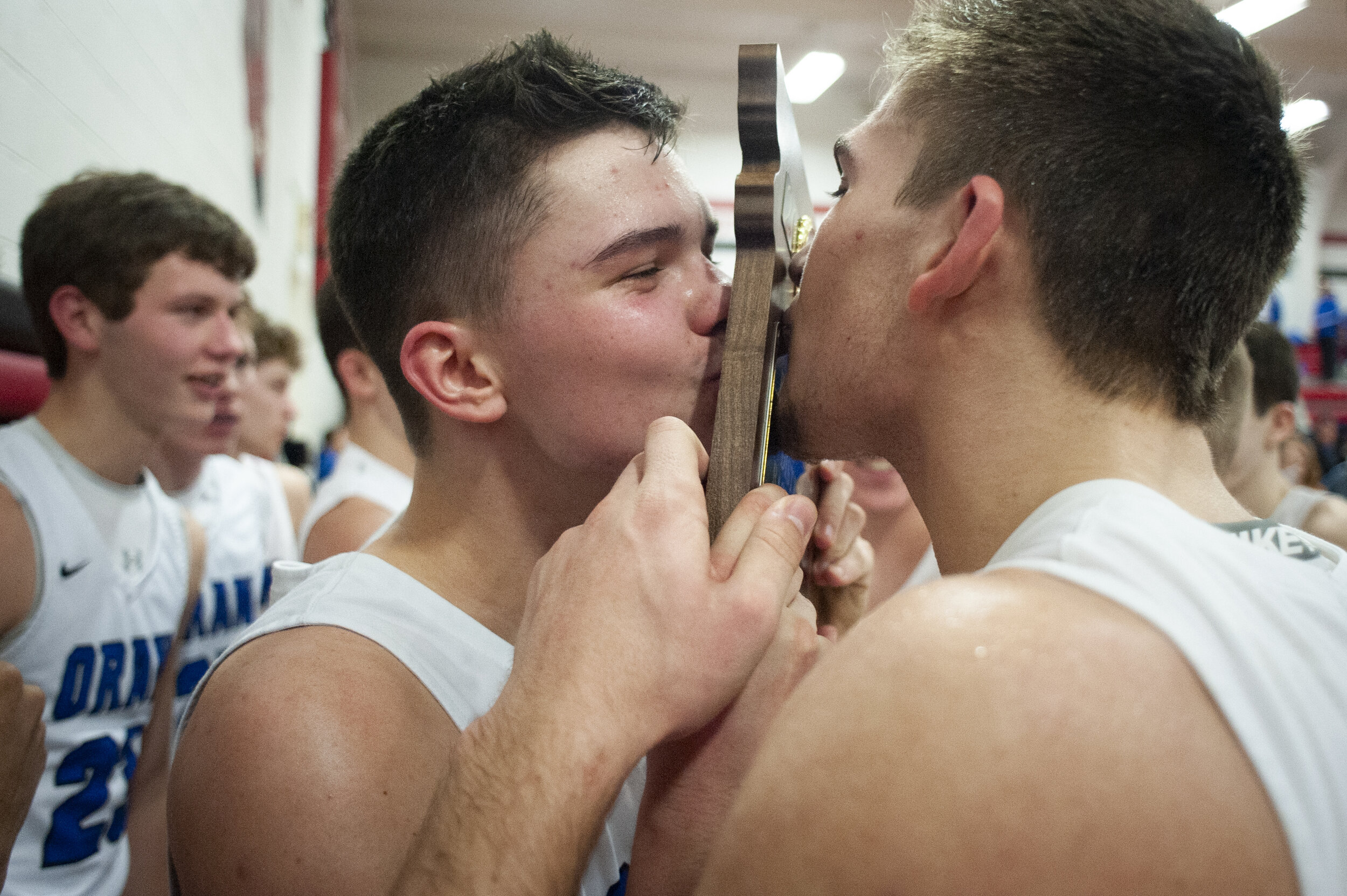  Oran's Ty Johnson (33), on left, and Todd Priggel (35) kiss the championship plaque following the Eagles' 89-72 win against the Oak Ridge BlueJays in the Missouri Class 2 District 3 championship Feb. 22 at Chaffee High School in Chaffee, Missouri. 