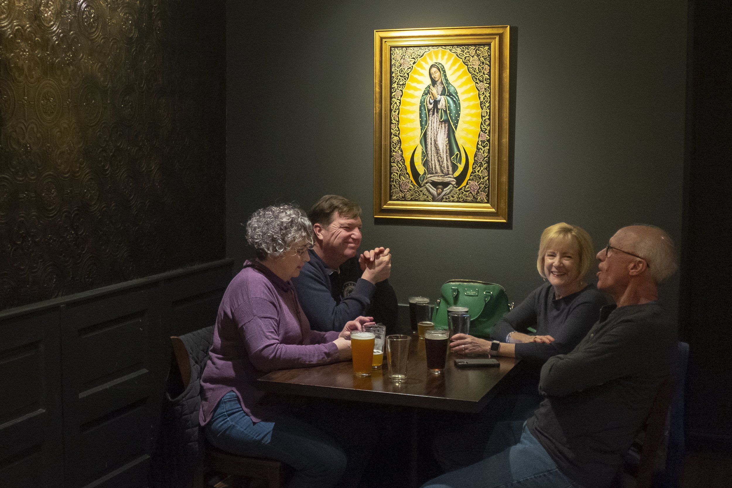  Ed and Carla Kaiser, left side of table, and John and Agnes Boul, all parishioners of St. Gabriel the Archangel, conversed under a picture of Our Lady of Guadalupe during a BARCIA gathering March 14 at The Golden Hoosier in St. Louis, Missouri. The 