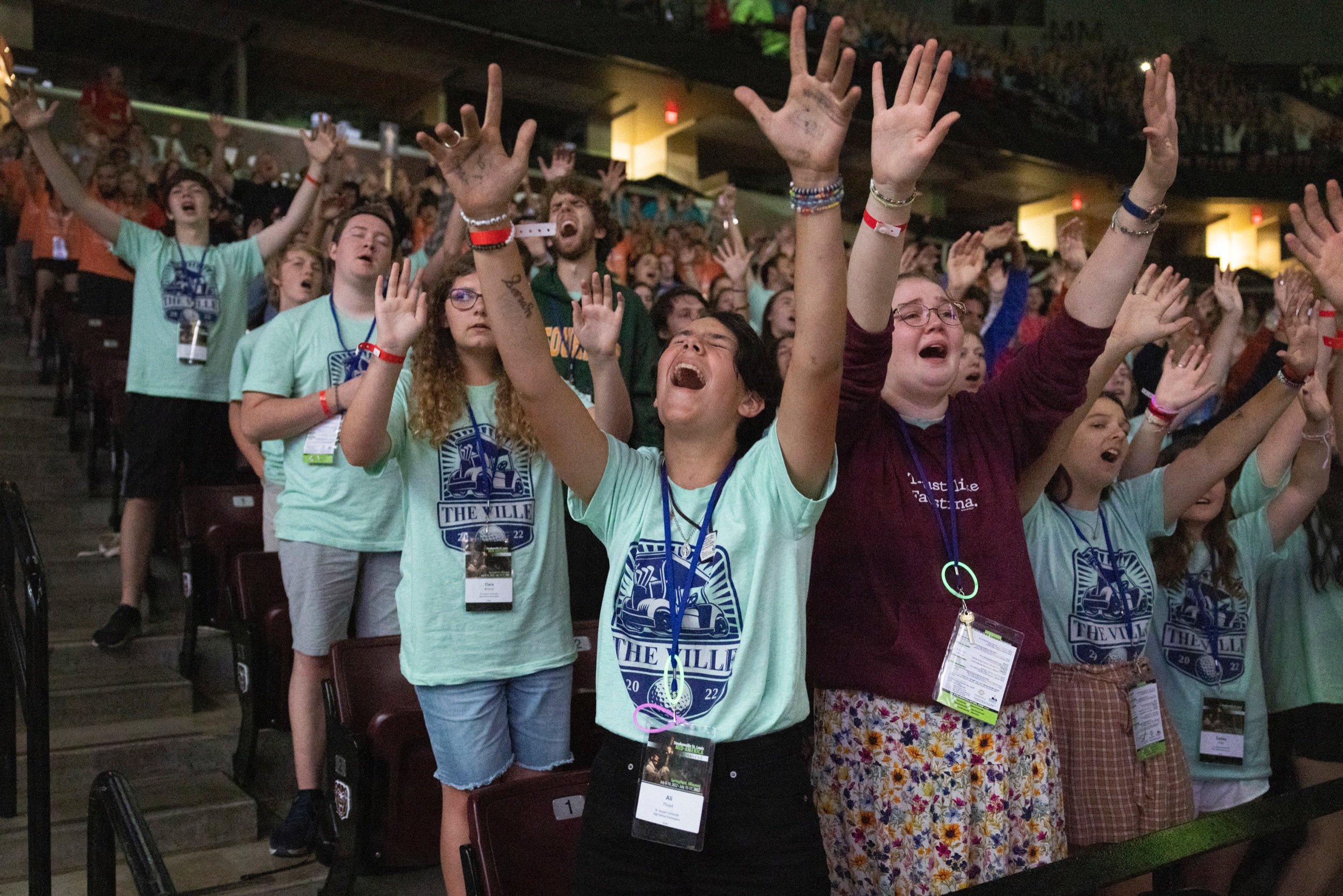  Ali Thuet raised arms in worship during week two of the Steubenville STL Mid-America youth conference July 16 at the Great Southern Bank Arena in Springfield, Missouri. About 3,300 people attended the second weekend of the Catholic youth conference 