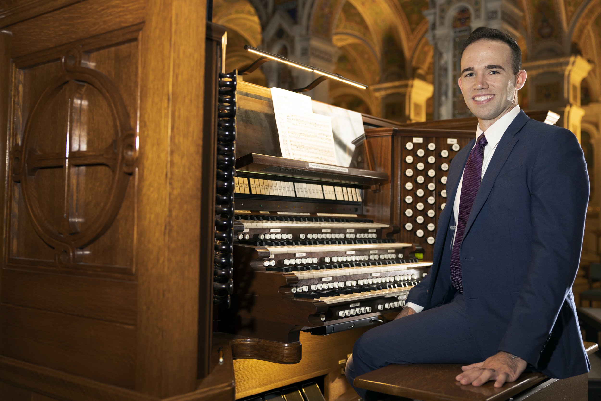  Andrew Kreigh, who recently started in the position of director of sacred music for the Archdiocese of St. Louis and the Cathedral Basilica of St. Louis, posed for a portrait July 19 at the Cathedral Basilica of St. Louis in St. Louis, Missouri. 
