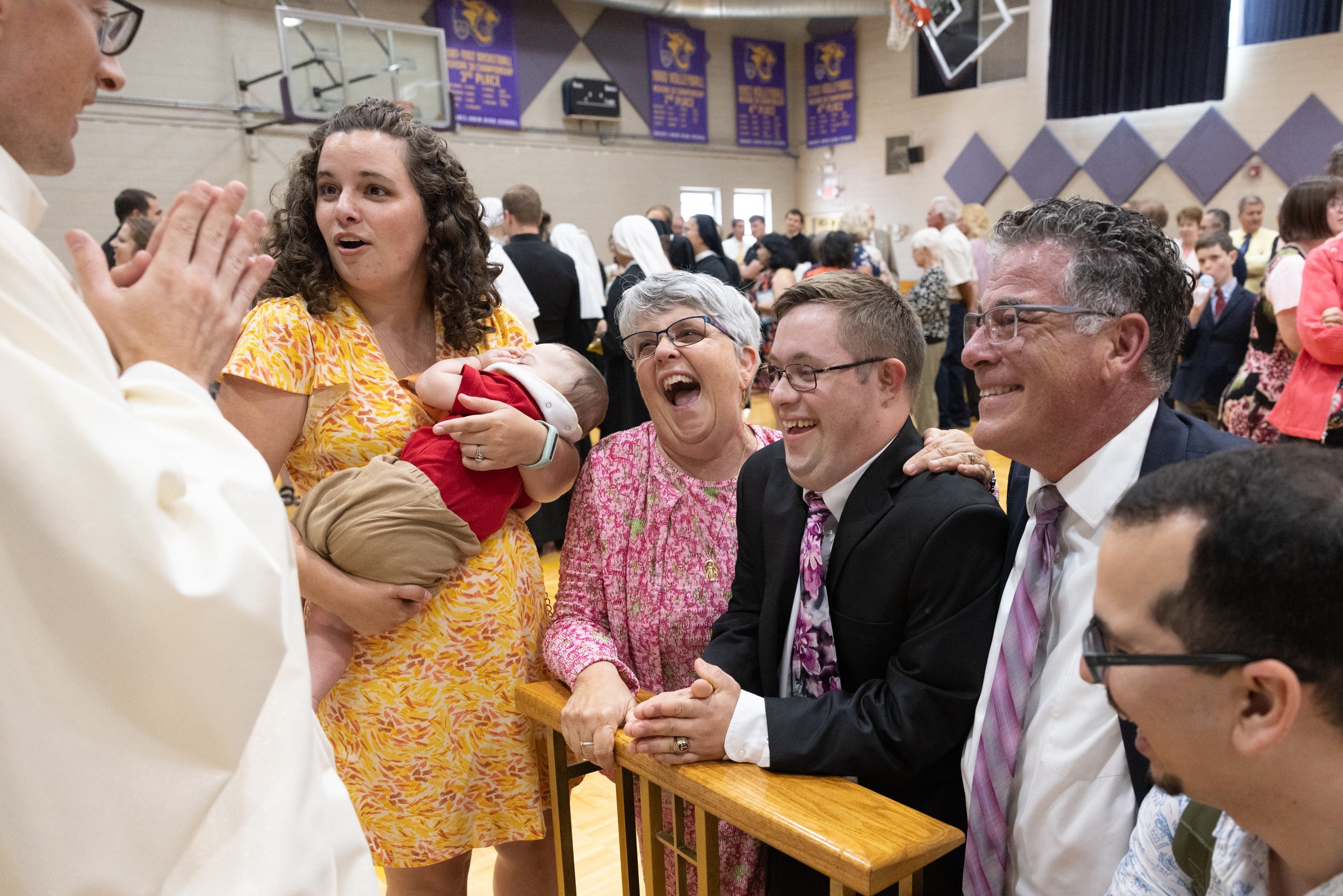  Father Joshua Deters (left) met with Gabriel and his parents, Lori and Thomas; his sister, Amalie Collard; his nephew, Ignacio Davila; and his brother-in-law, Jay Davila, at a reception following Father Deters' ordination to the priesthood May 27 at