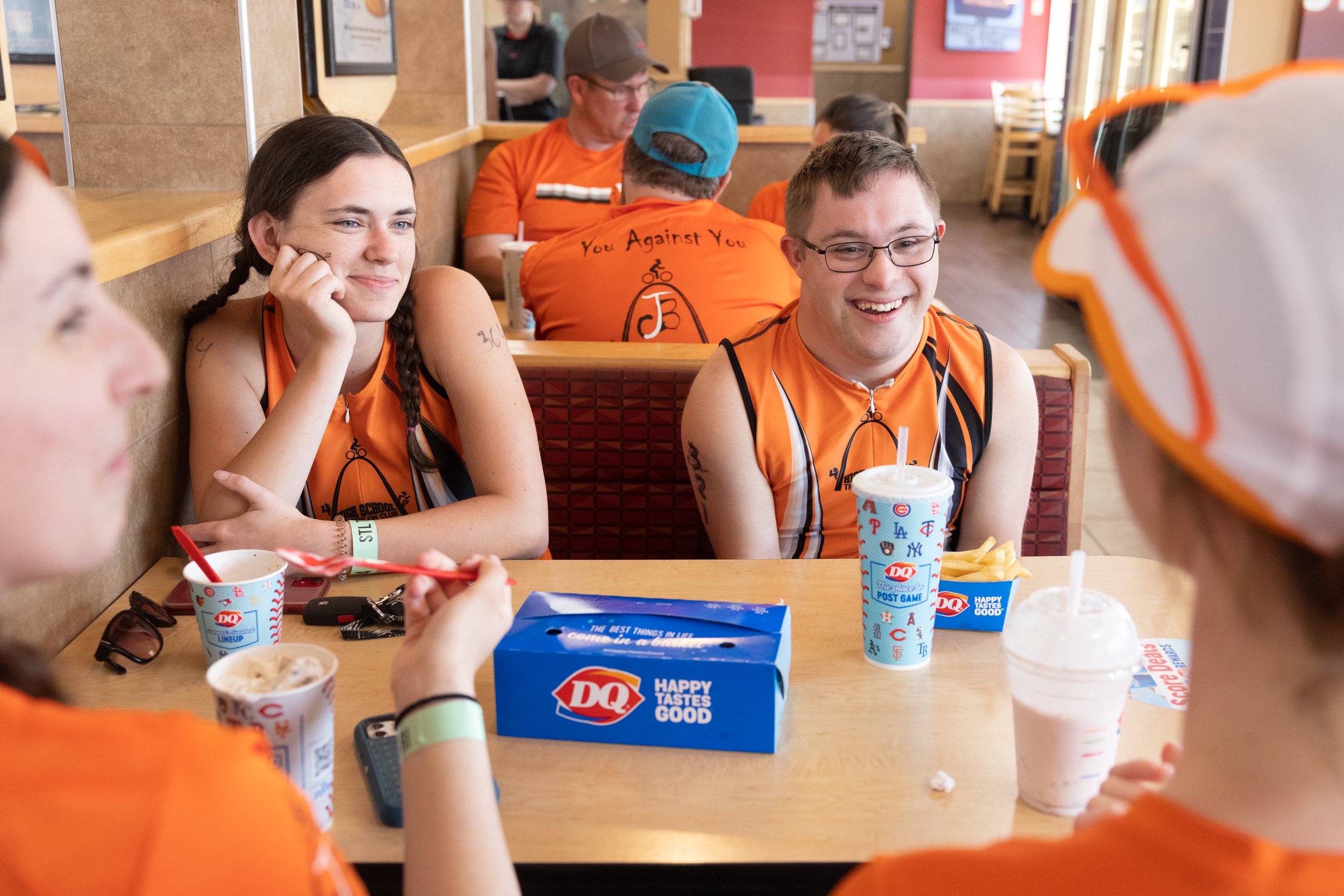  Gabriel smiled while getting food with teammates from the High School Triathlon Club, including Caroline Rousseau (next to Gabriel), Faith Curry (left in foreground) and Trinity Young (right in foreground), following a race May 21 at Dairy Queen in 