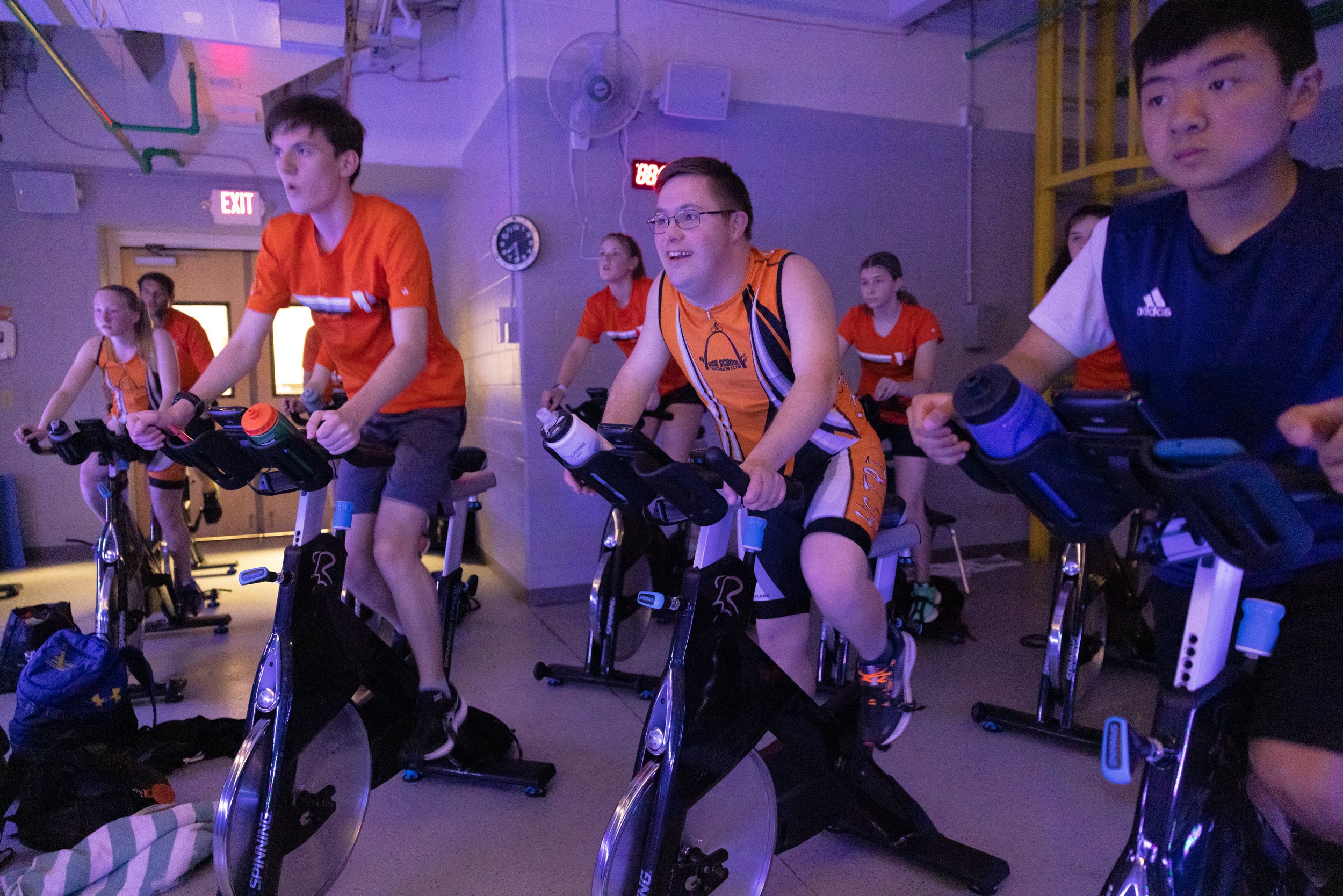  Gabriel (center), a parishioner at St. Joseph in Cottleville, trained for triathlons next to Caleb Young (left) and Isaac Schaefer (right) on April 25 at O'Fallon Family YMCA in O'Fallon, Missouri.  