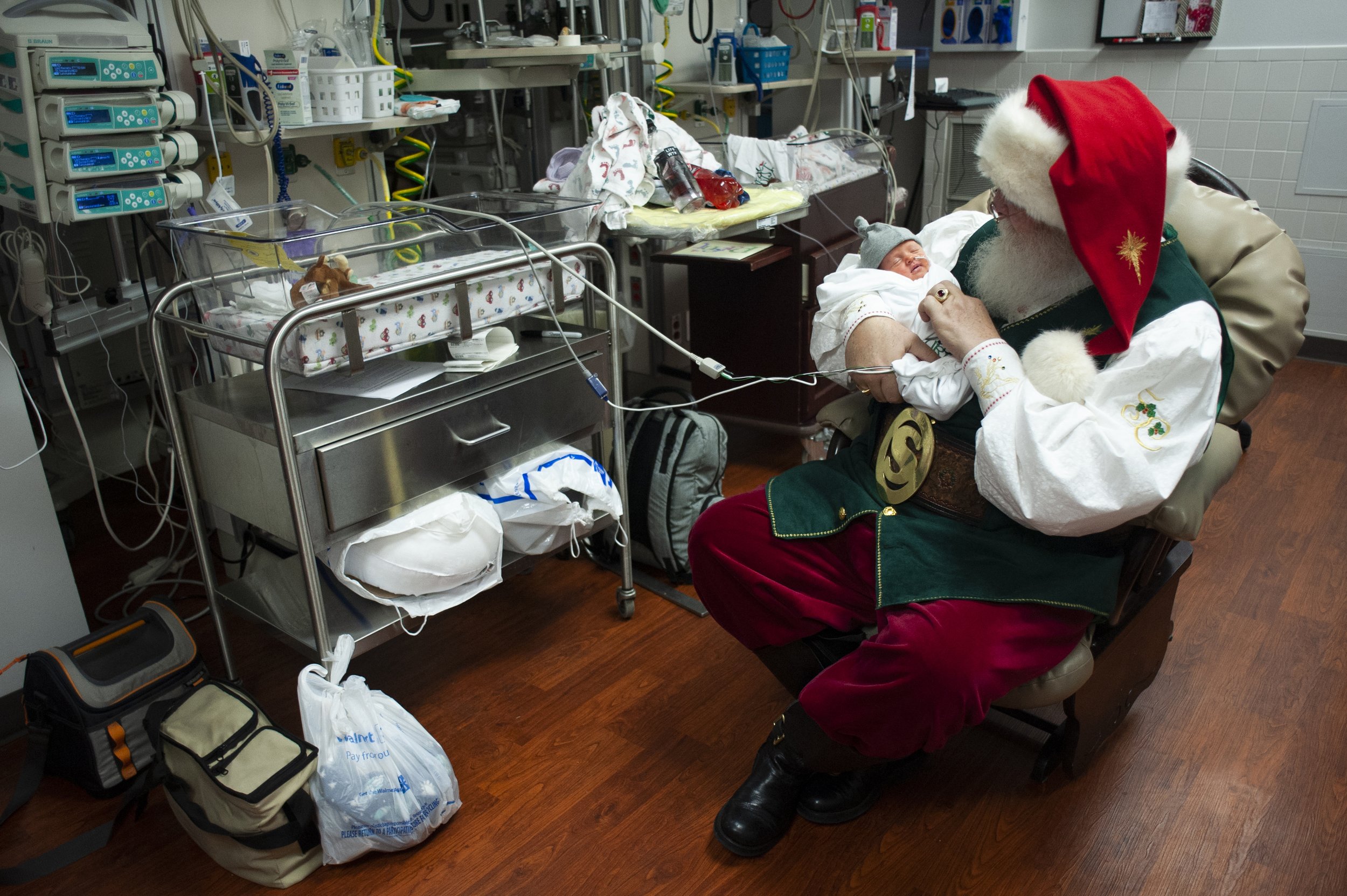 Santa Claus, portrayed by Steve Southard of Jonesboro, pays a visit to 9-day-old William “Liam” Clairday on Dec. 20 at St. Bernards Medical Center’s Neonatal Intensive Care Unit (NICU) in Jonesboro, Arkansas. “This is one of my emotional stops,” Sou