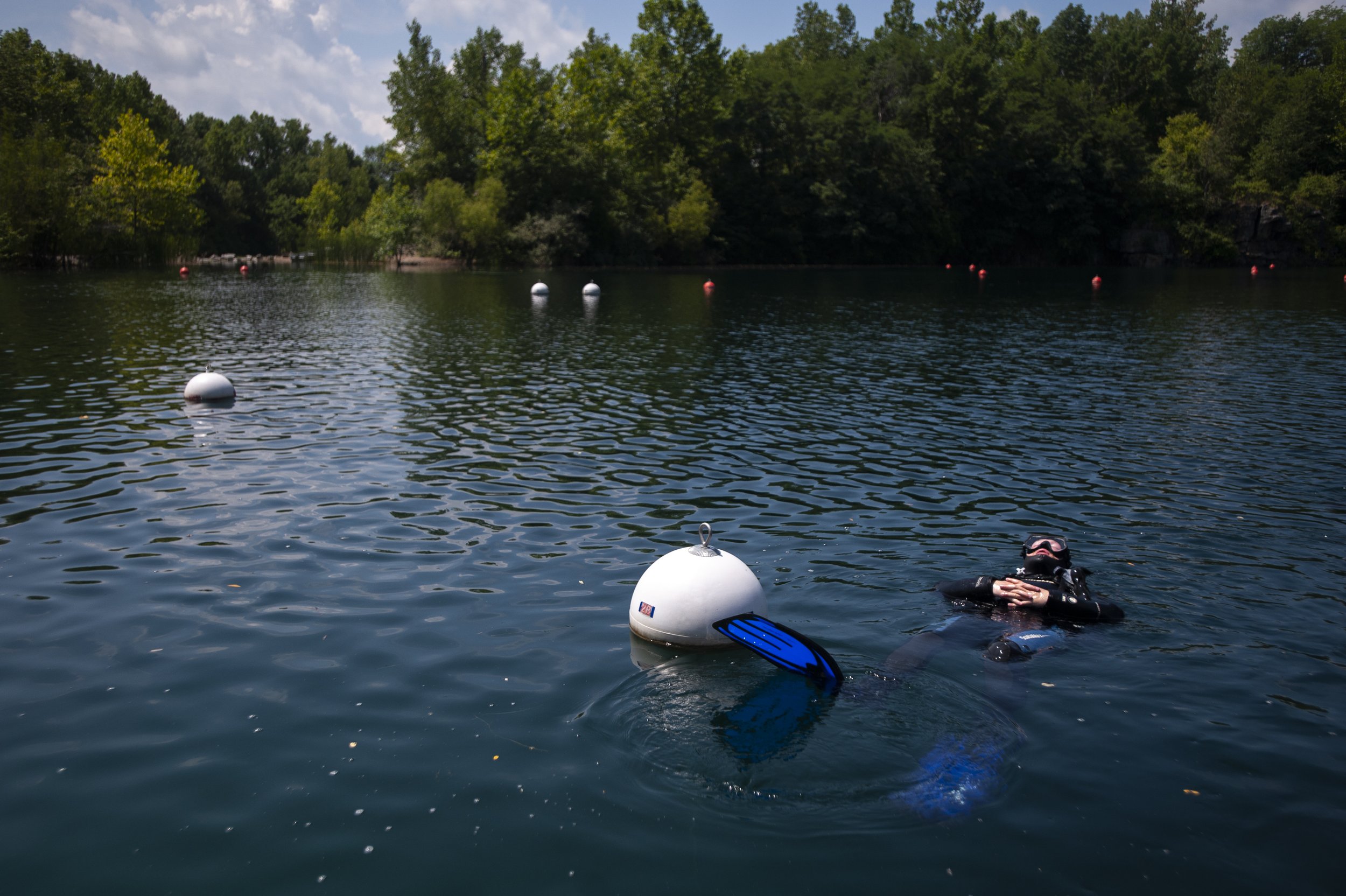  James Parris of Dexter, Missouri, floats in the water after the final scuba dive he needed to become a certified open water diver July 21 at Mermet Springs in Massac County, Illinois.  