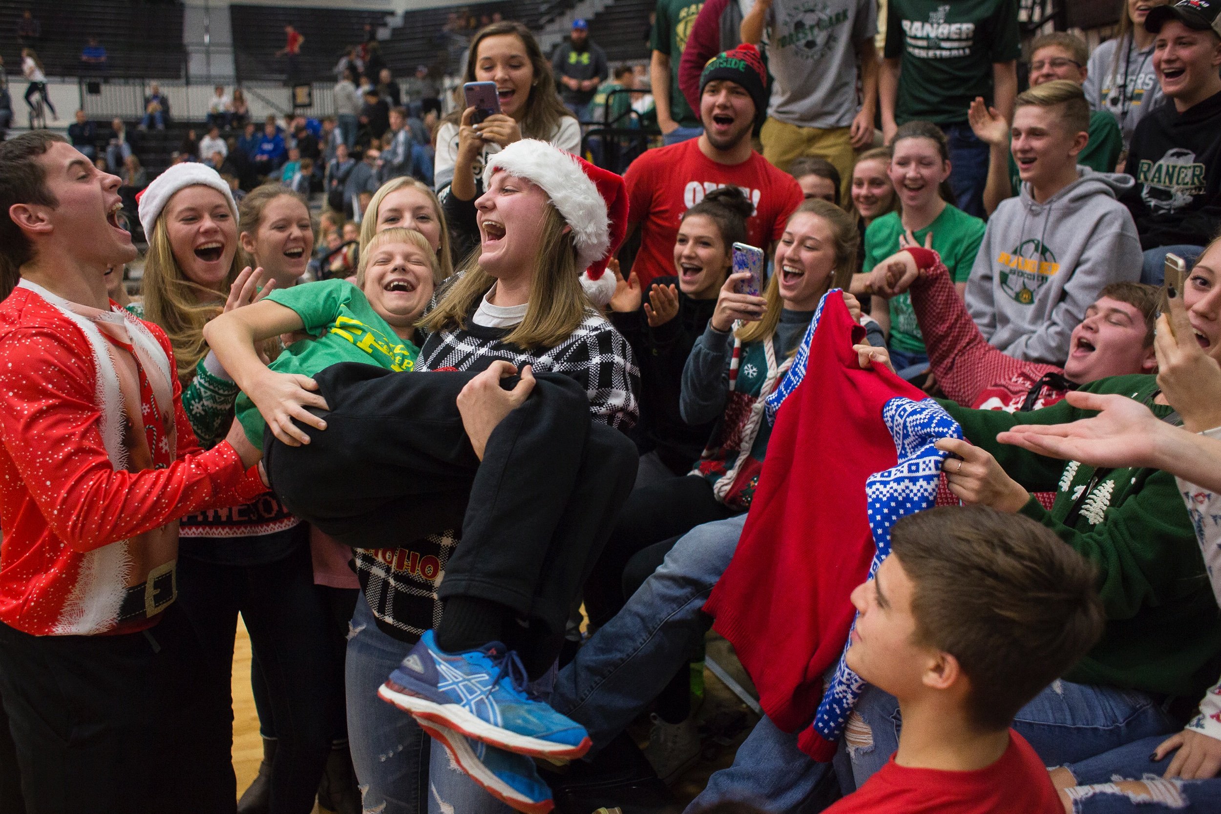  Forest Park senior Taylor Bayer acted out pulling Forest Park eighth-grader Bryce Troesch from the womb of Forest Park senior Nolan Gentry during halftime of the Rangers' 55-34 victory against Jasper in the Dubois County Hoops Classic on Dec. 16 at 