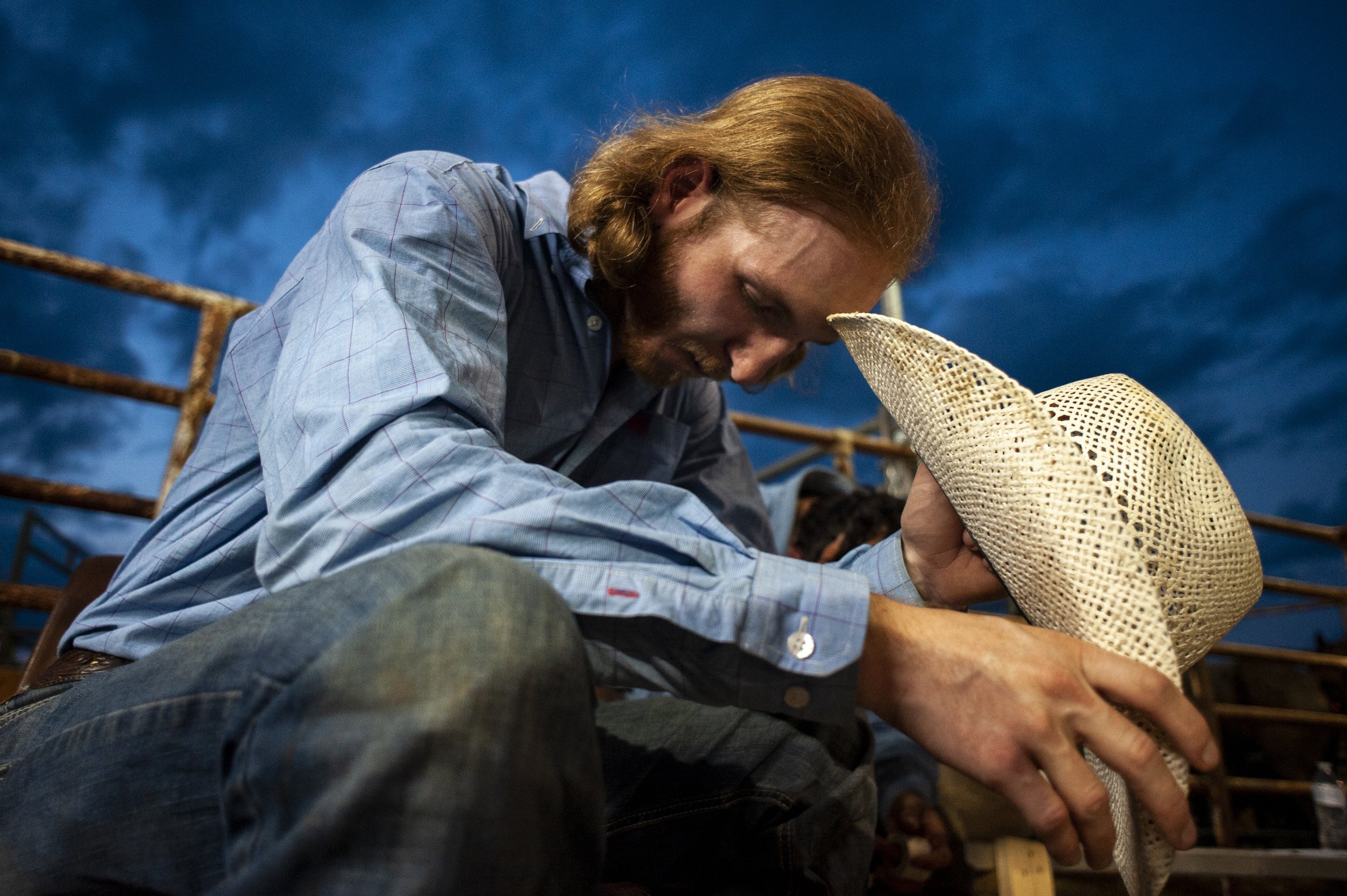  Gray Essary, of Somerville, Tennessee, bows his head in prayer before his bull ride during the Lawrence County PRCA Rodeo on Aug. 18 at Lawrence County Fairgrounds in Imboden, Arkansas.  The 23-year-old, who makes a living traveling “coast to coast,