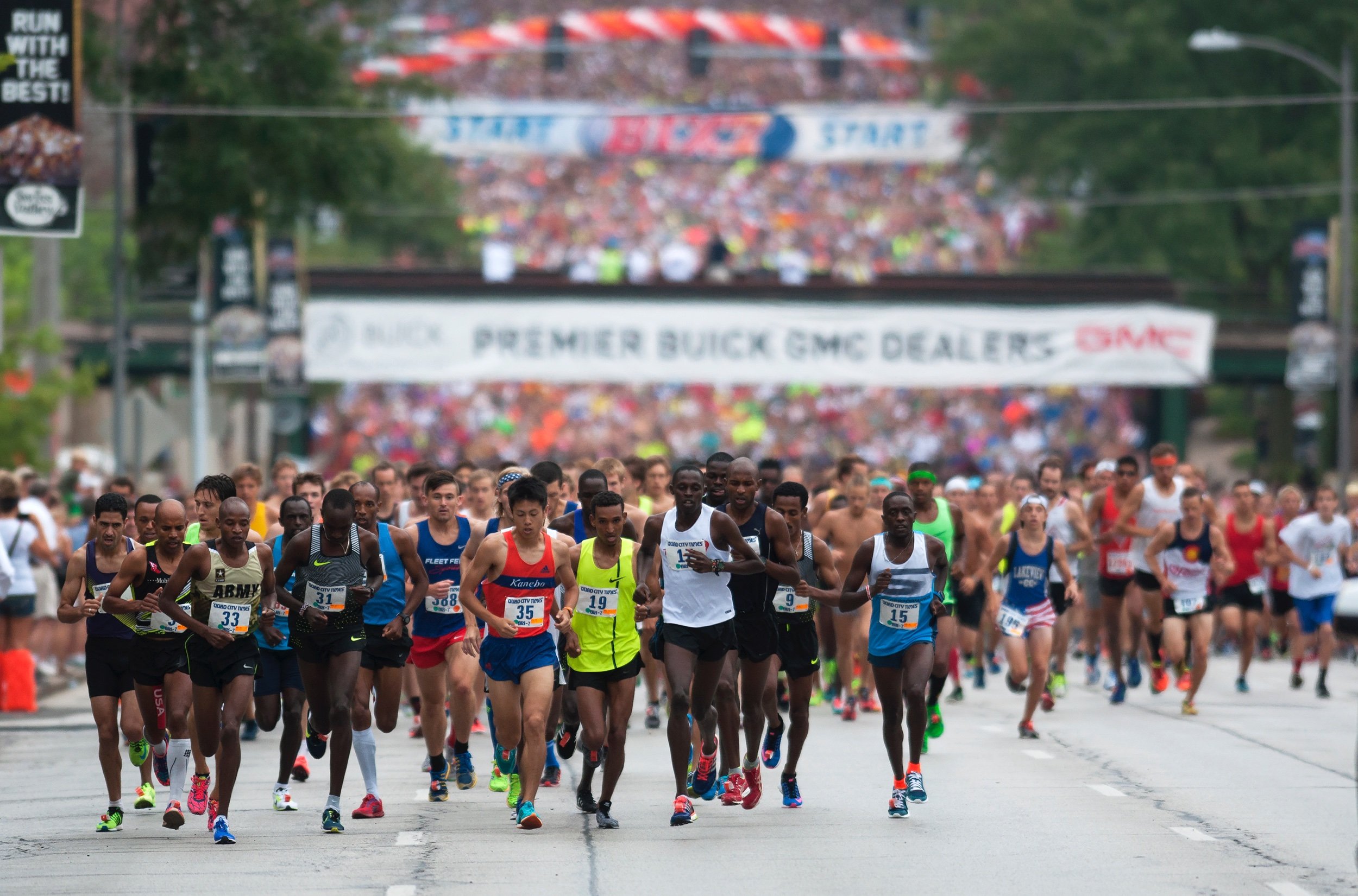  A pack of runners leads thousands of athletes up the Brady Street hill at the start of the Quad City Times Bix 7 on July 30 in Davenport, Iowa. Runners came from near and far to take part in the 42nd running of the 7-mile race. 