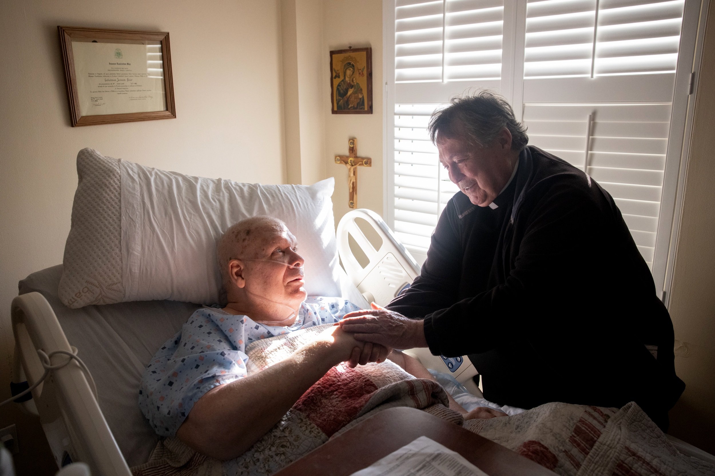 Msgr. Kevin Callahan, the archbishop's liaison to senior priests, met with Father Bill Baier on Oct. 29 at Mother of Good Counsel Home in Northwoods, Missouri. “Mostly it’s just to let them know they’re still loved and cared (for) and part of a fami