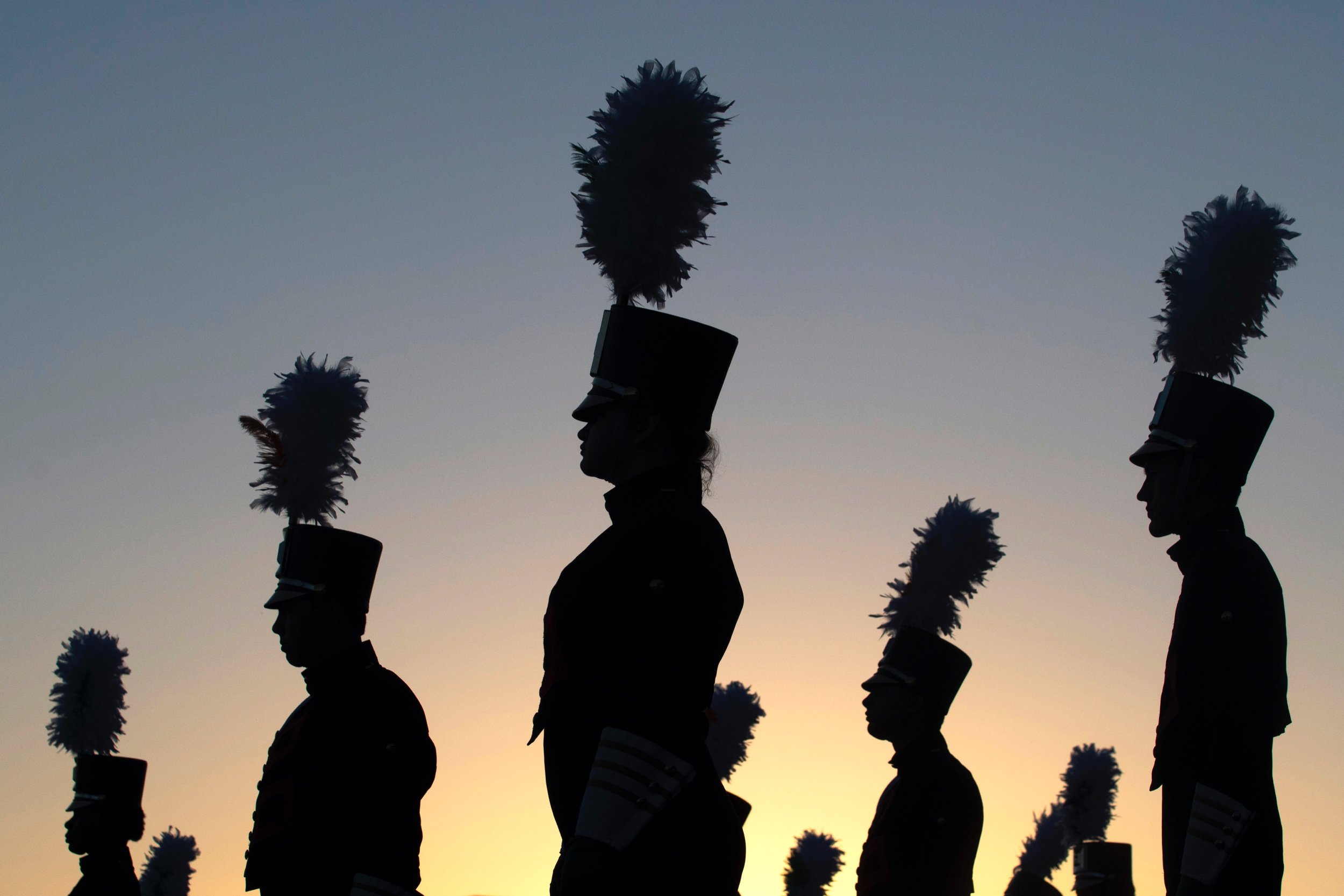 Jonesboro High School Marching Band members warm-up before taking the field for their final marching competition of the season Oct. 27 in Jonesboro, Arkansas.