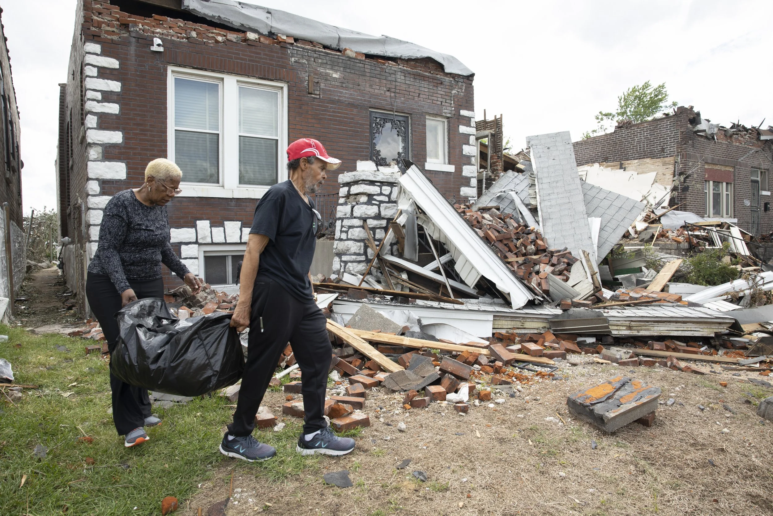  Deborah and Reggie McMurtry, hauled belongings from their home that was severely damaged in the May 16 tornado on May 20 along Natural Bridge Avenue in the Greater Ville neighborhood of north St. Louis. The couple had just gotten home Friday when th