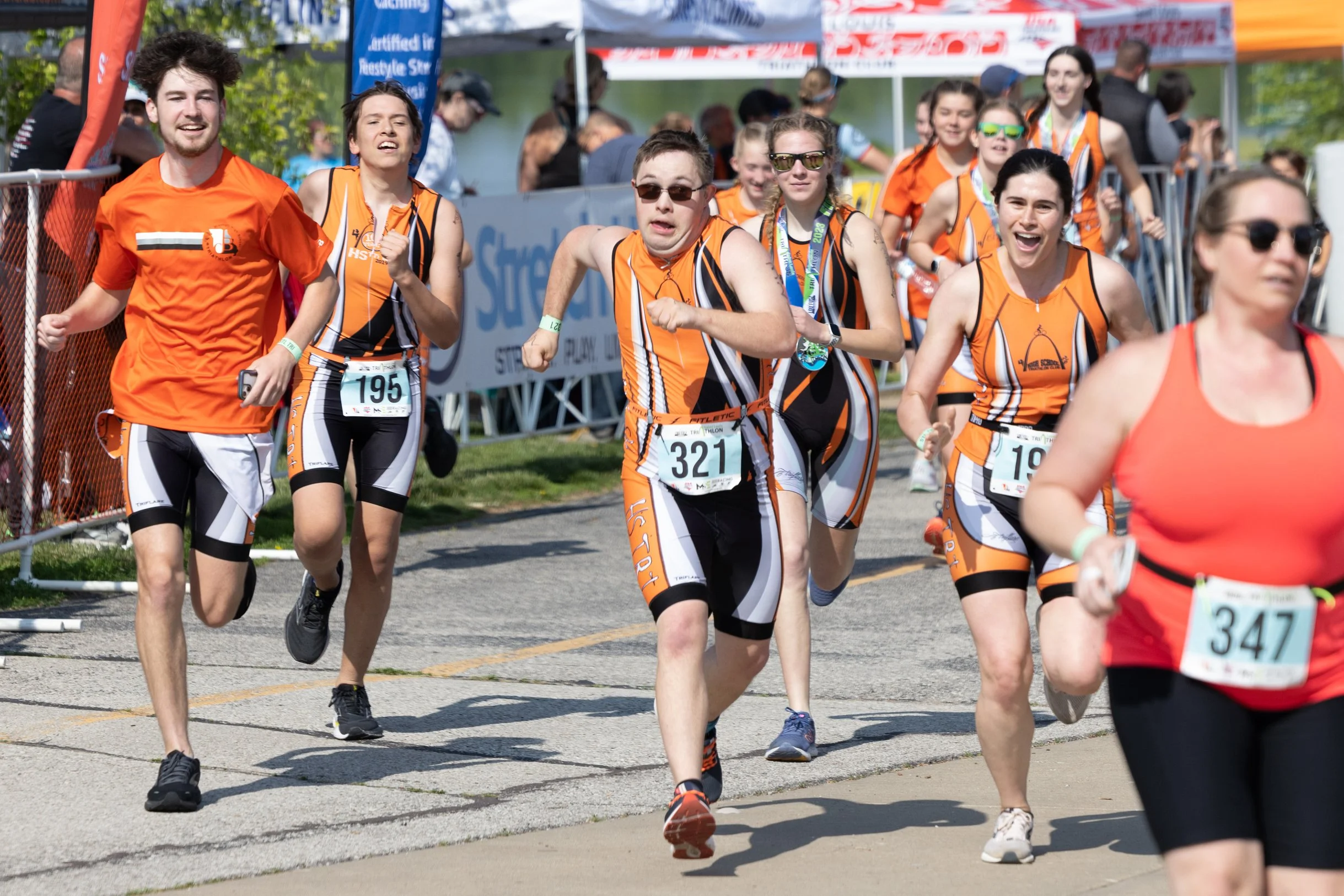  Gabriel ran toward the finish line of his second triathlon of the year May 21 at Creve Coeur Lake in Maryland Heights. Members of the High School Triathlon Club accompanied Gabriel to the finish line as is the team's tradition with its last athlete 