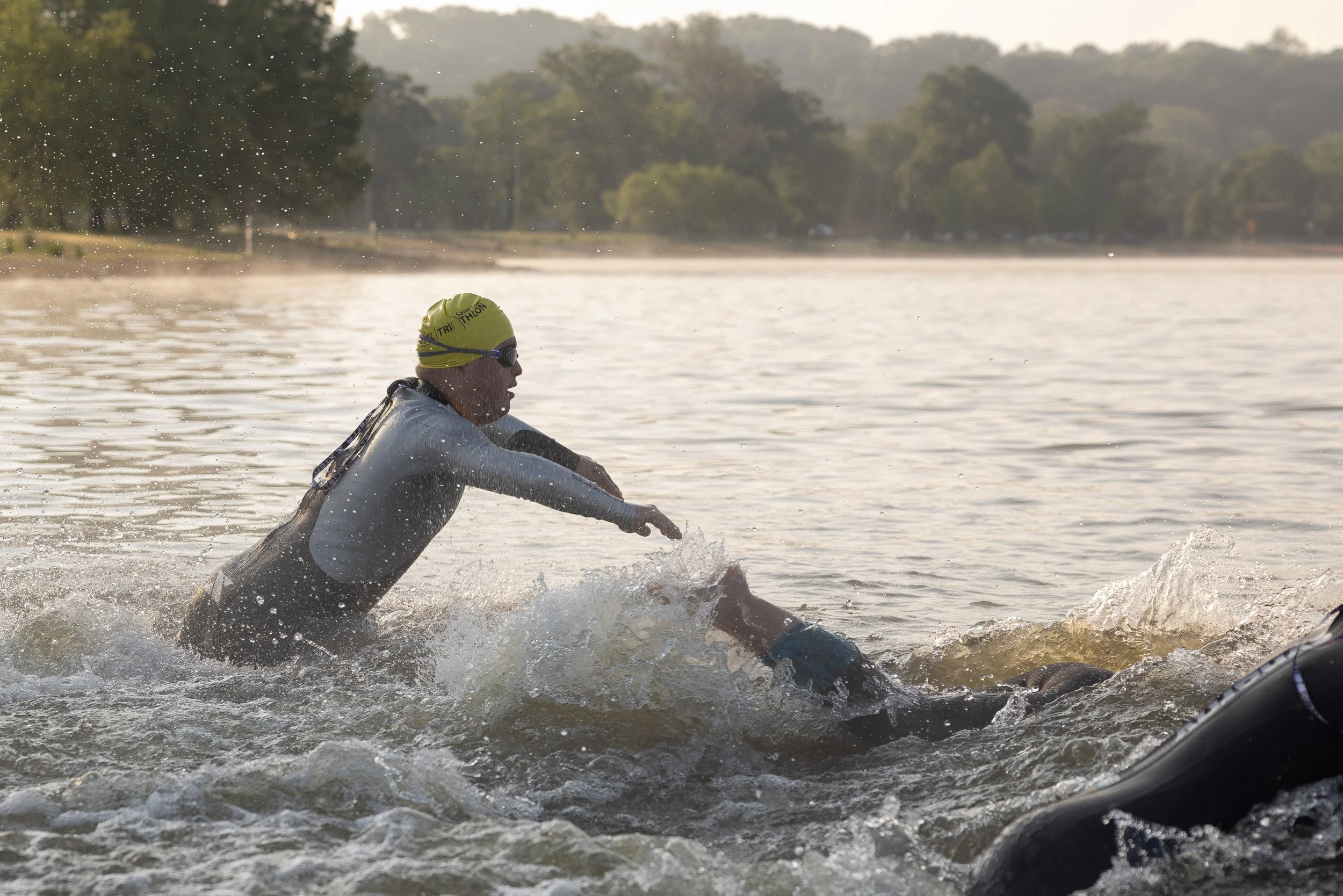  Gabriel Cobb dove into Creve Coeur Lake at the start of his second triathlon of the year May 21 at Creve Coeur Lake in Maryland Heights, Missouri.&nbsp; 