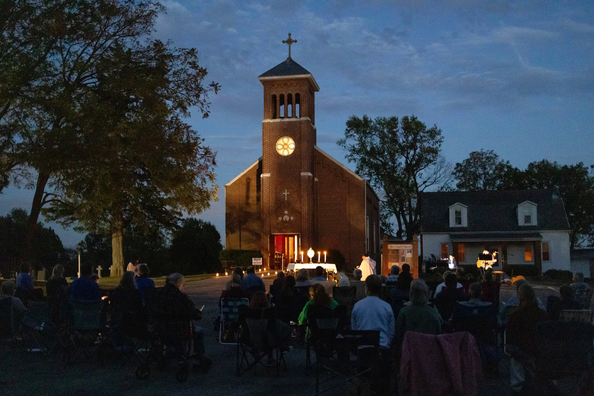  Faithful prayed in front of the Eucharist at an "Adoration Under the Stars" event Oct. 12 at Holy Family Parish in Port Hudson. The gathering featured outdoor eucharistic adoration and praise and worship music. Some attendees also consecrated themse