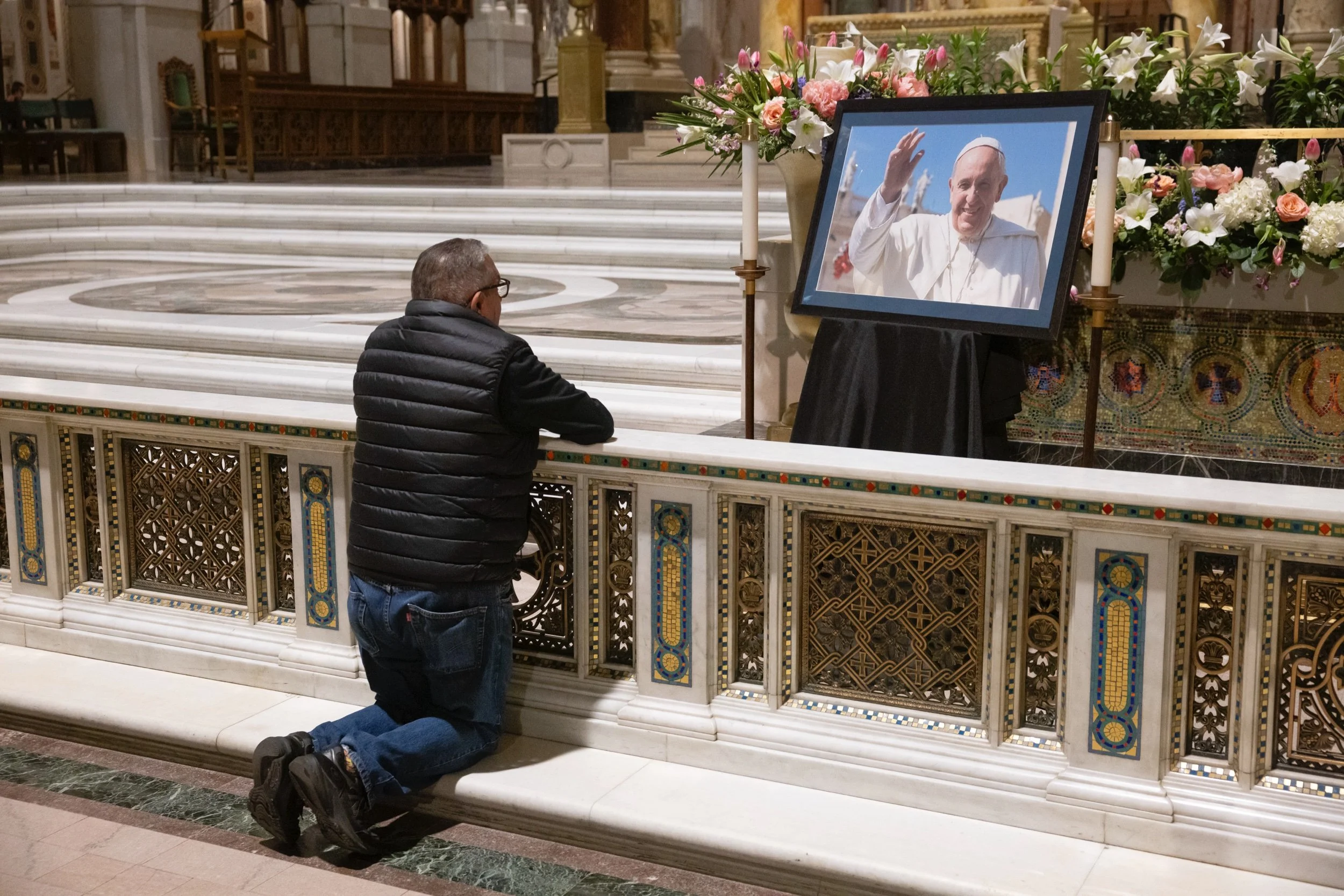  Jesse Aguirre prayed in front of an image of the late Pope Francis on April 21 at the Cathedral Basilica of Saint Louis. Pope Francis, the first Latin American pope, died April 21 at 88. “He was a good man and he was a Latin pope. I’m Latin. So I ju